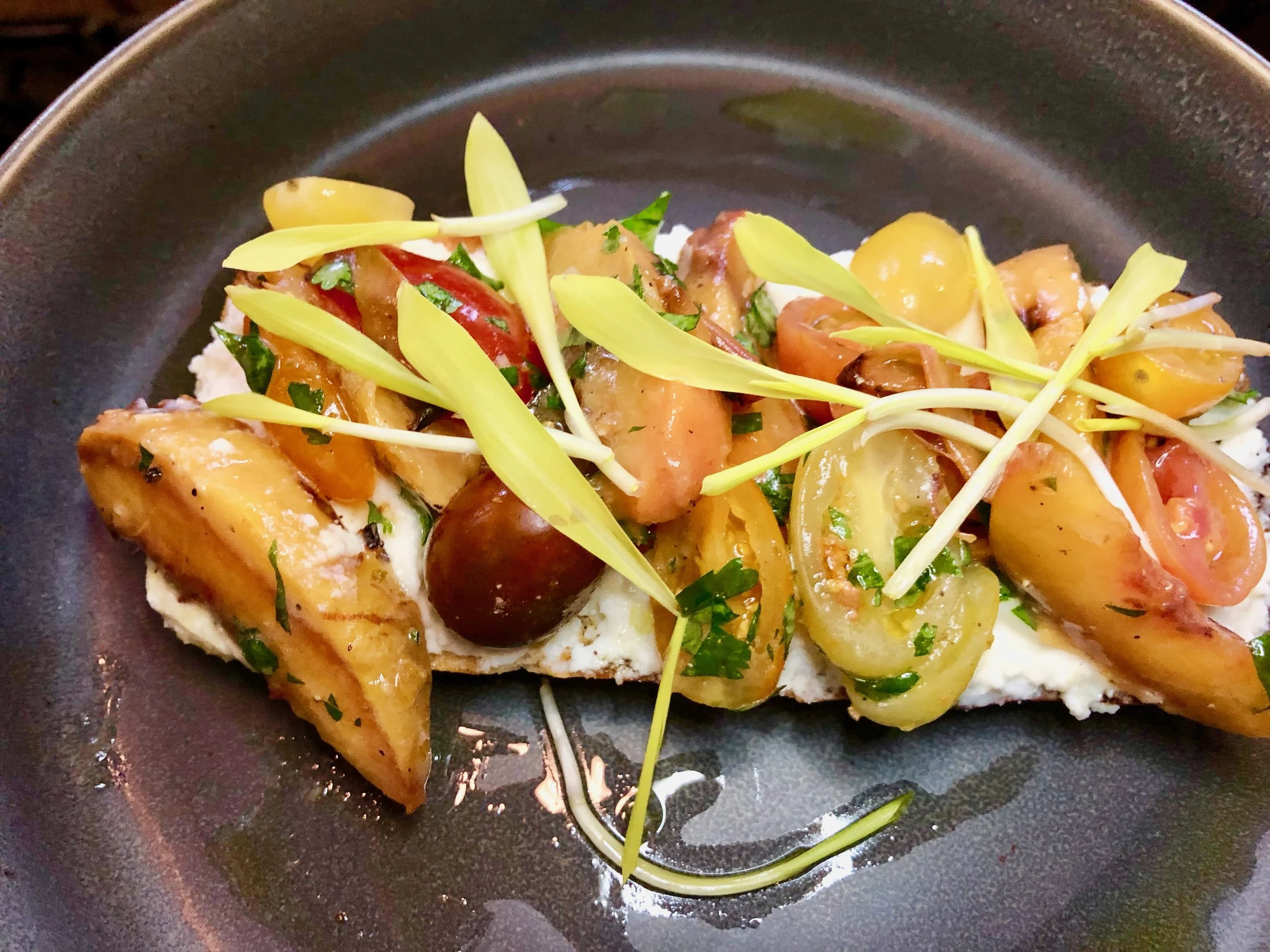 Reyes Mezcaleria – Peach Mollette. It’s grilled rustic bread with a spread of utlra-fresh queso fresco and topped with grilled peaches, mint and radish. Also: Instagrammable if you’re good with a camera.