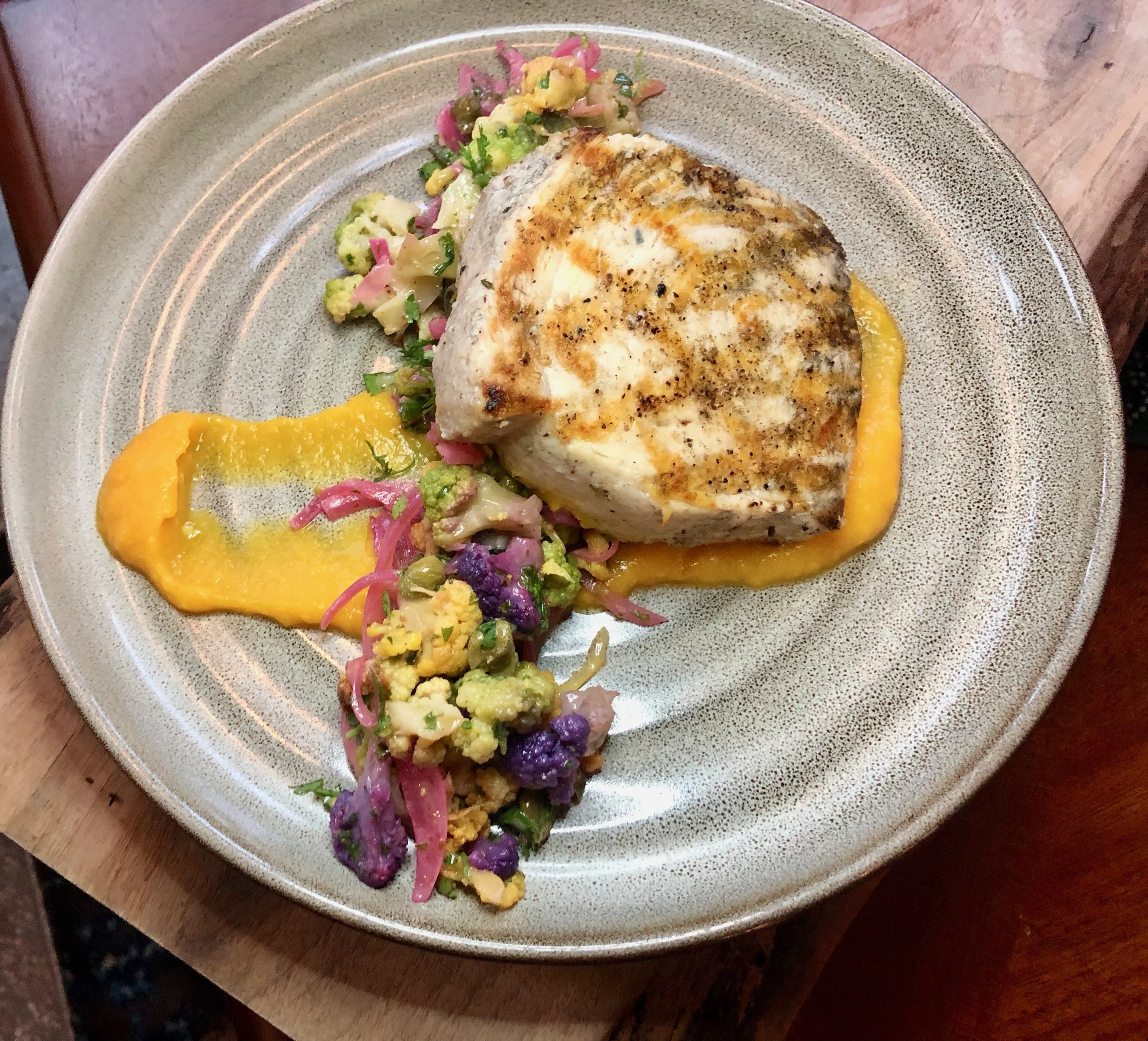 Reyes Mezcaleria – We lucked out having swordfish during our Orlando Magical Dining Month 2019 preview, but you prob can’t go wrong. The Local Catch option is the day’s white fish, pan-seared, with sweet corn puree and a rainbow cauliflower-caper-salsa.