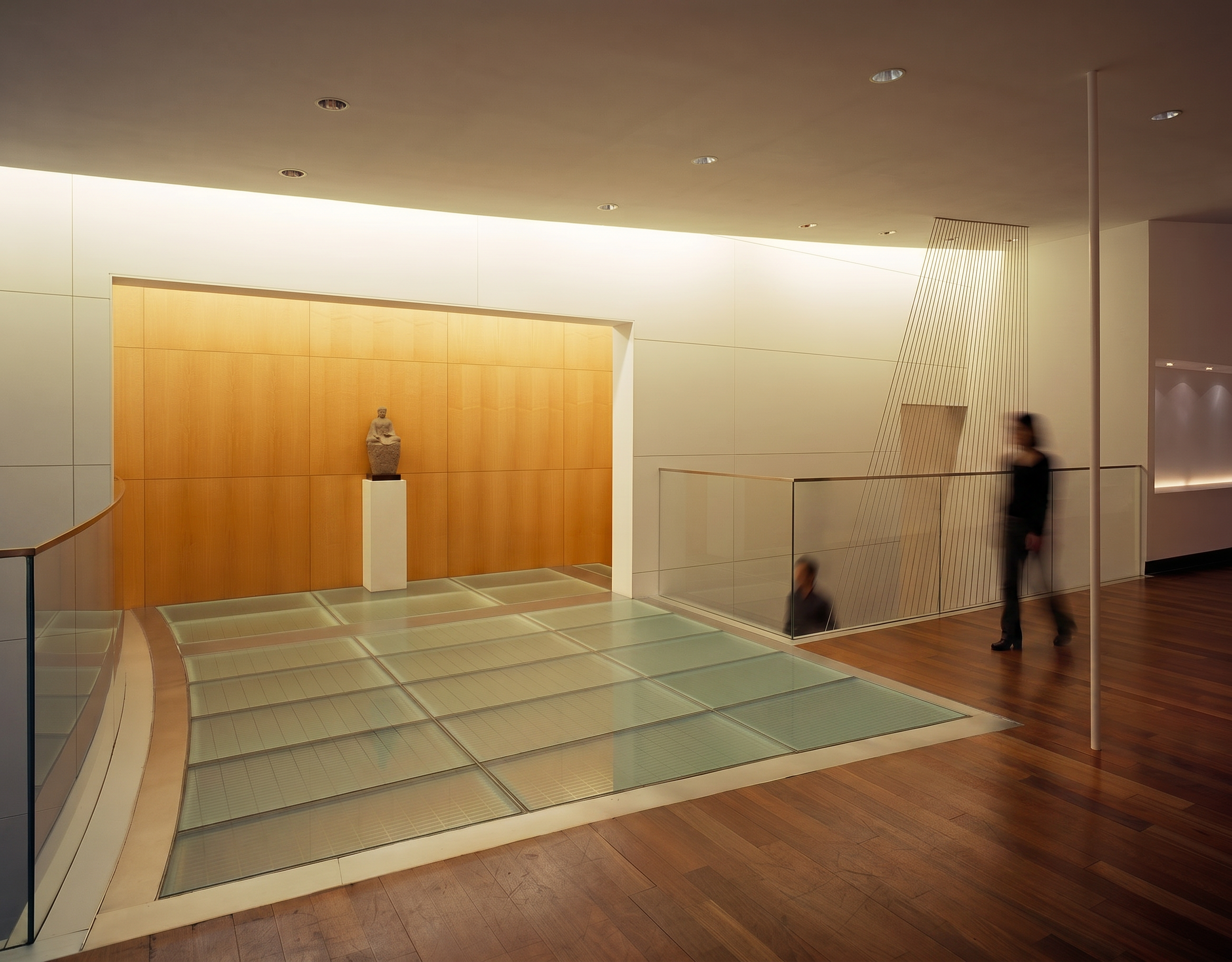 Illuminated mezzanine bridge within the atrium of the Taipei Economic and Cultural Office, Manhattan