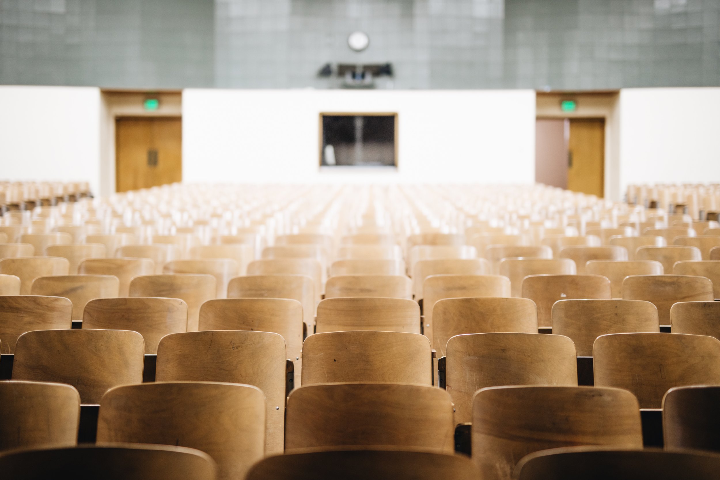 empty testing center with rows of seats