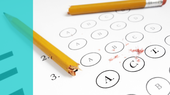 a broken pencil resting on a bubble-in test