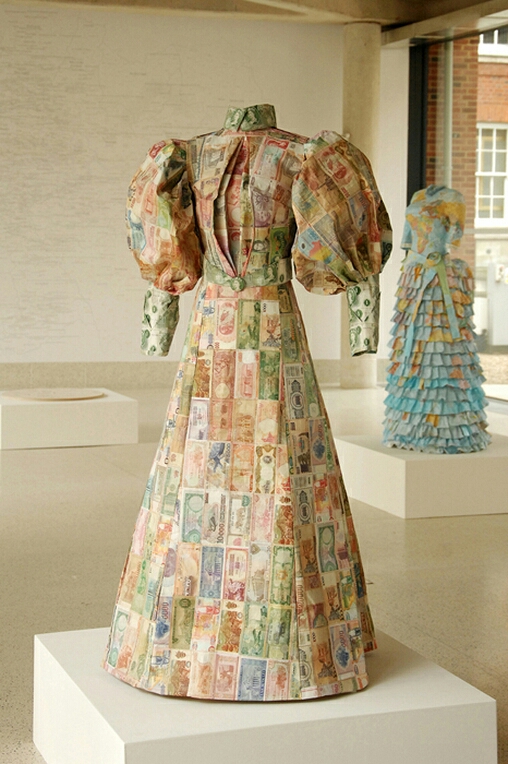 Susan Stockwell is an amazing British artist that uses technology, ecology and politics in her works while also incorporating recycled computer parts and other everyday materials. Here we have "The Money Dress" which she designed and was made with paper money from all over the world. These particular style of dresses were inspired by the very ones worn by british Female Explorers in the 1870's.... from Shawn Lloyd's blog
