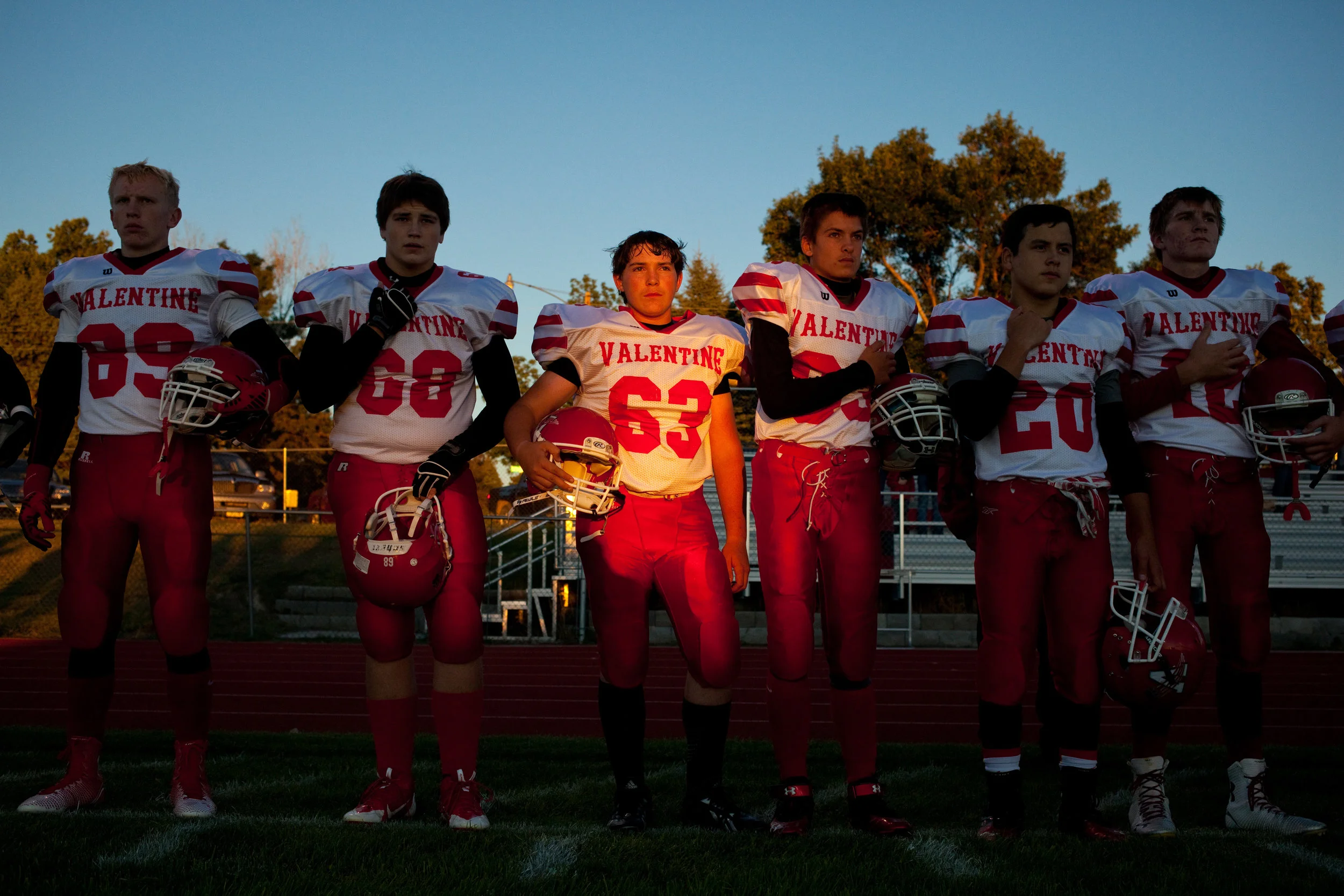  Valentine High School football players during the national anthem before their game against Chadron Senior High School in Chadron, Nebraska. Valentine lost 40-0. 