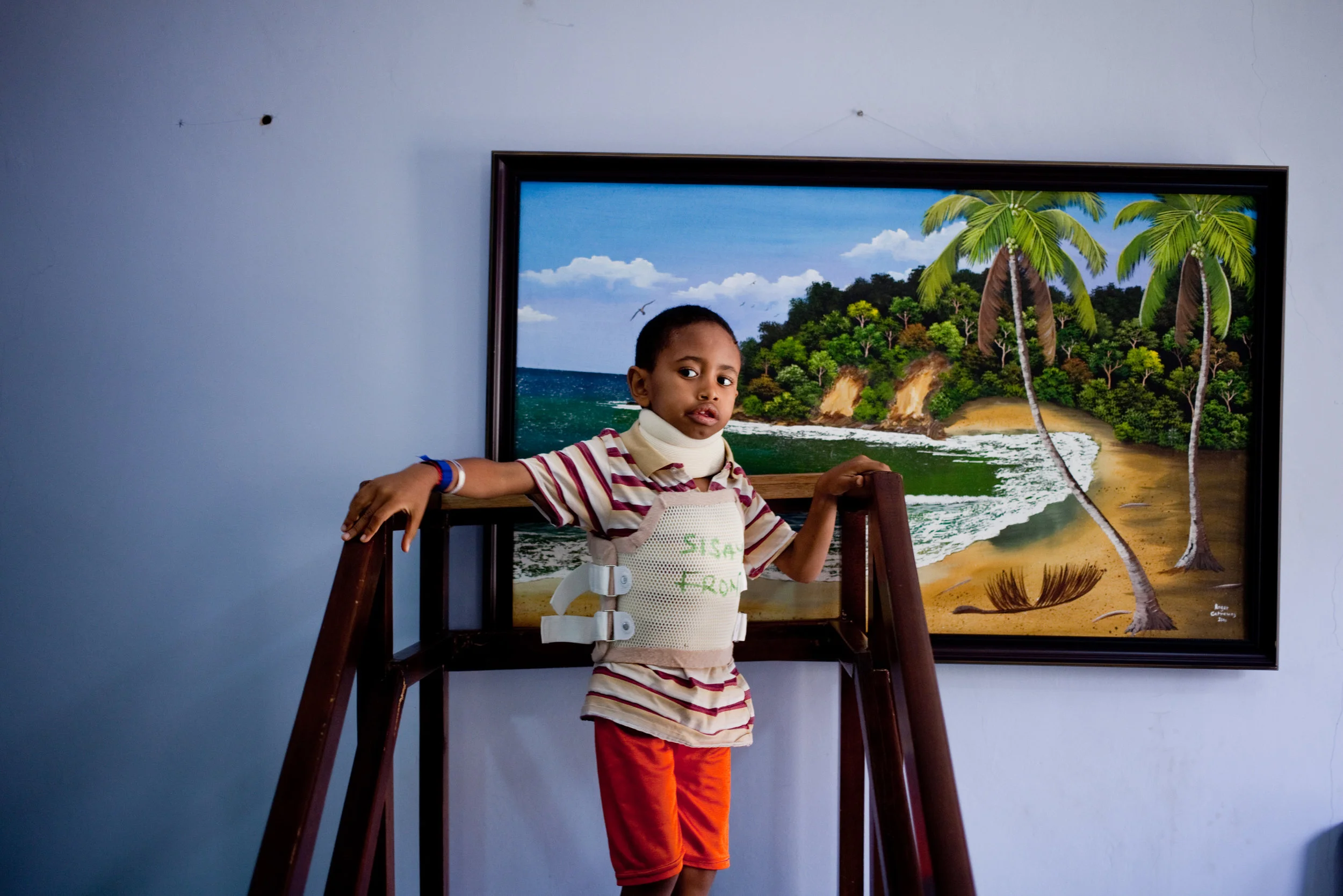  Sisay performs physical therapy at the FOCOS hospital in Accra, Ghana, almost 4,000 miles from home. Every three months, the American spine doctor Hodes sends about a dozen patients from Ethiopia to Ghana, where Dr. Oheneba Boachie-Adjei examines th