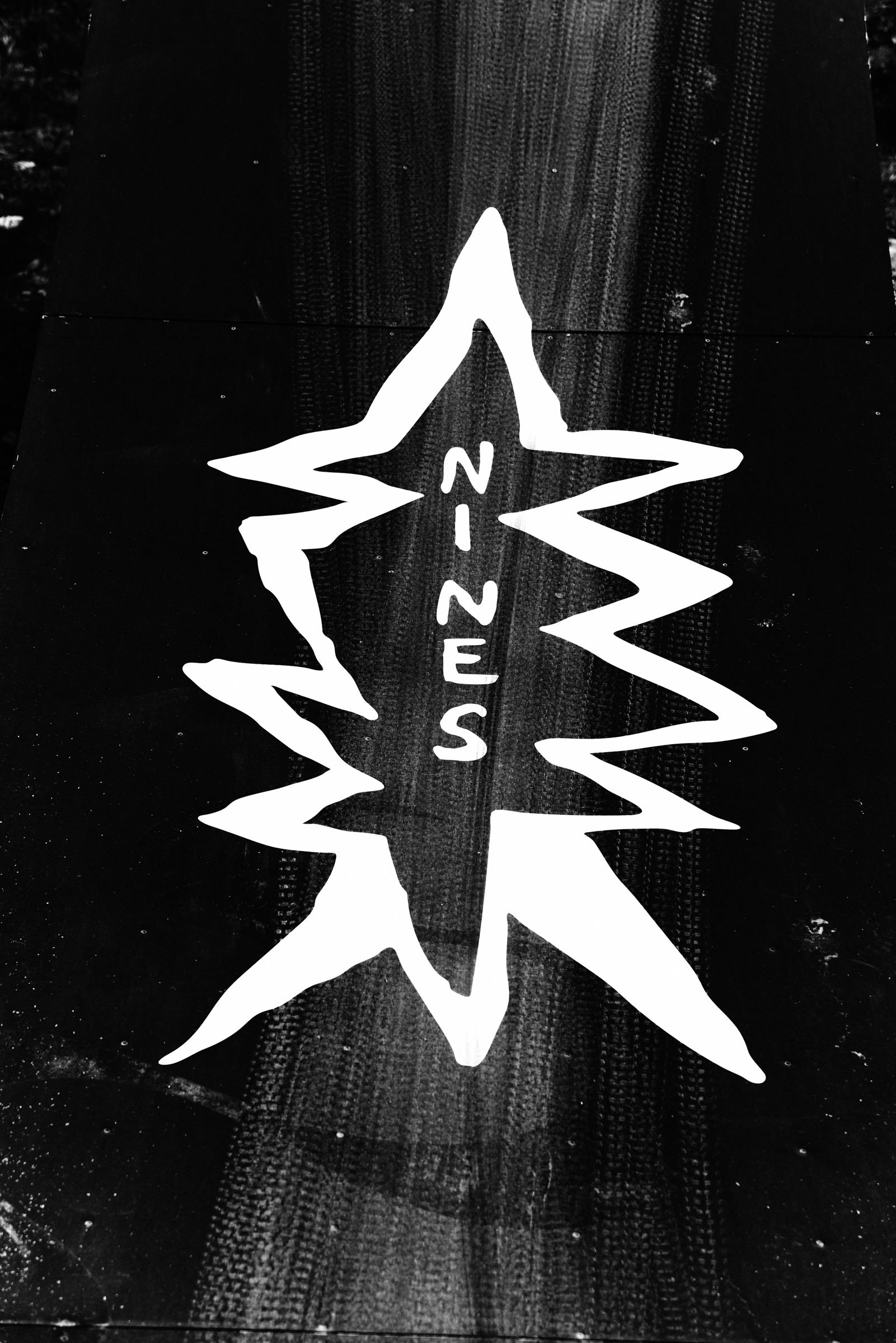 A black surface with a white outline of a star-shaped diss track logo and the word 'SHEEP' written in the middle.
