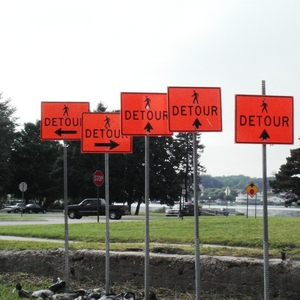 Confusing construction signs cause accidents.