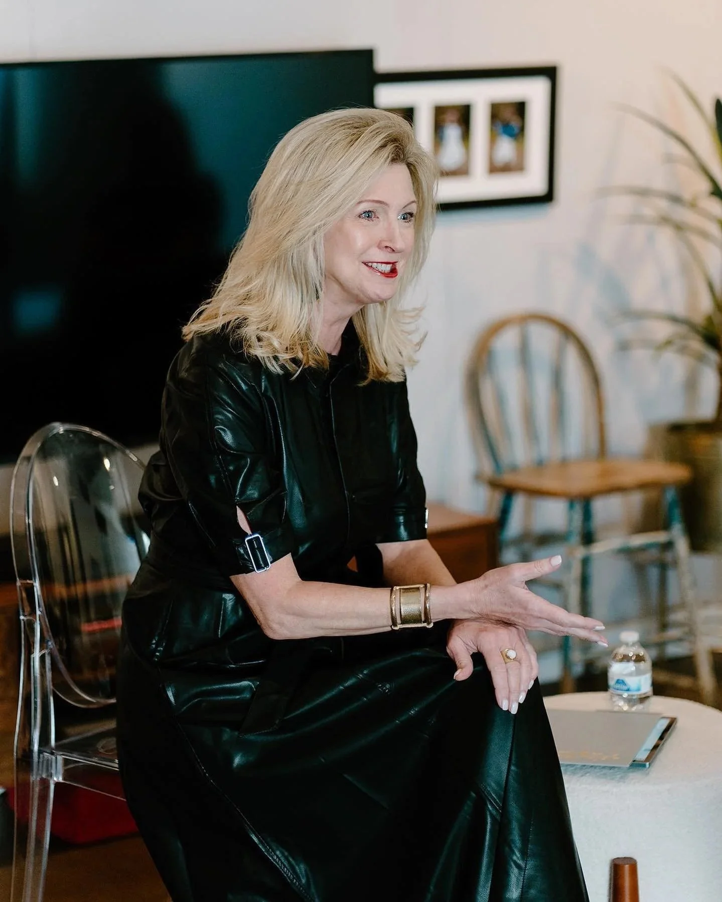 Kimberly in a black dress leading a workshop
