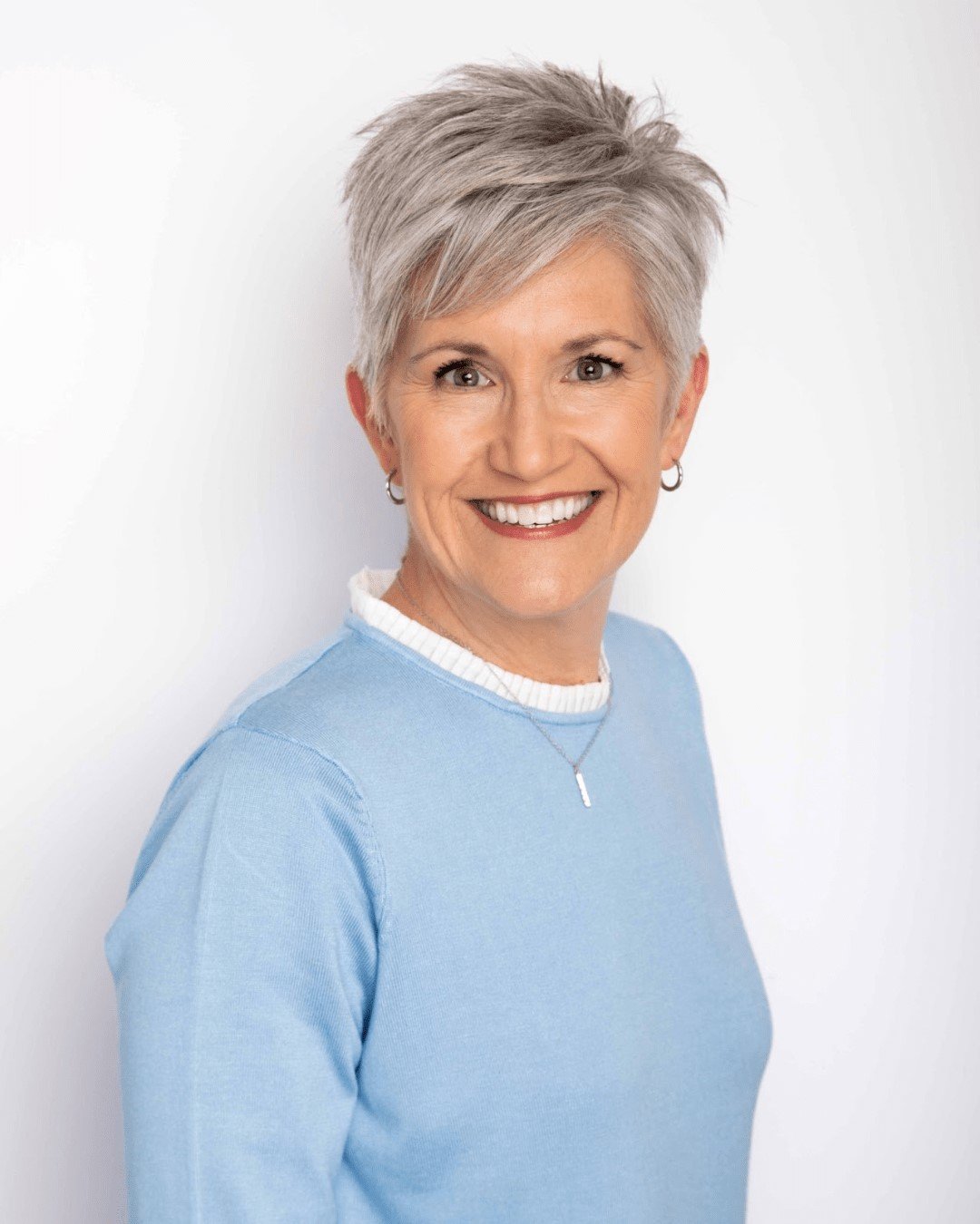 Lindsay Adams in a blue sweater