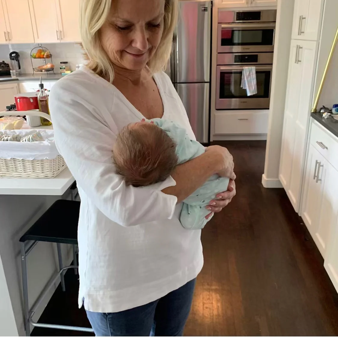 My mom completing this week’s challenge, maintaining good posture while holding my new nephew.