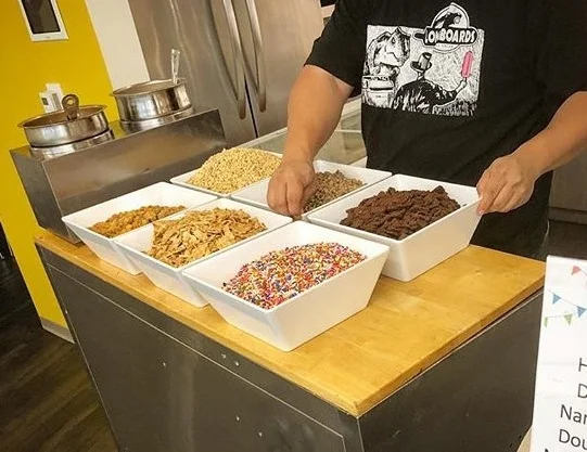 Table Setup! 1 hour of service up to 100 servings. 4 flavors of ice cream and frozen bananas. Milk and Dark Chocolate. 6-8 toppings to choose to go on the outside of your bar. Starting at $600.