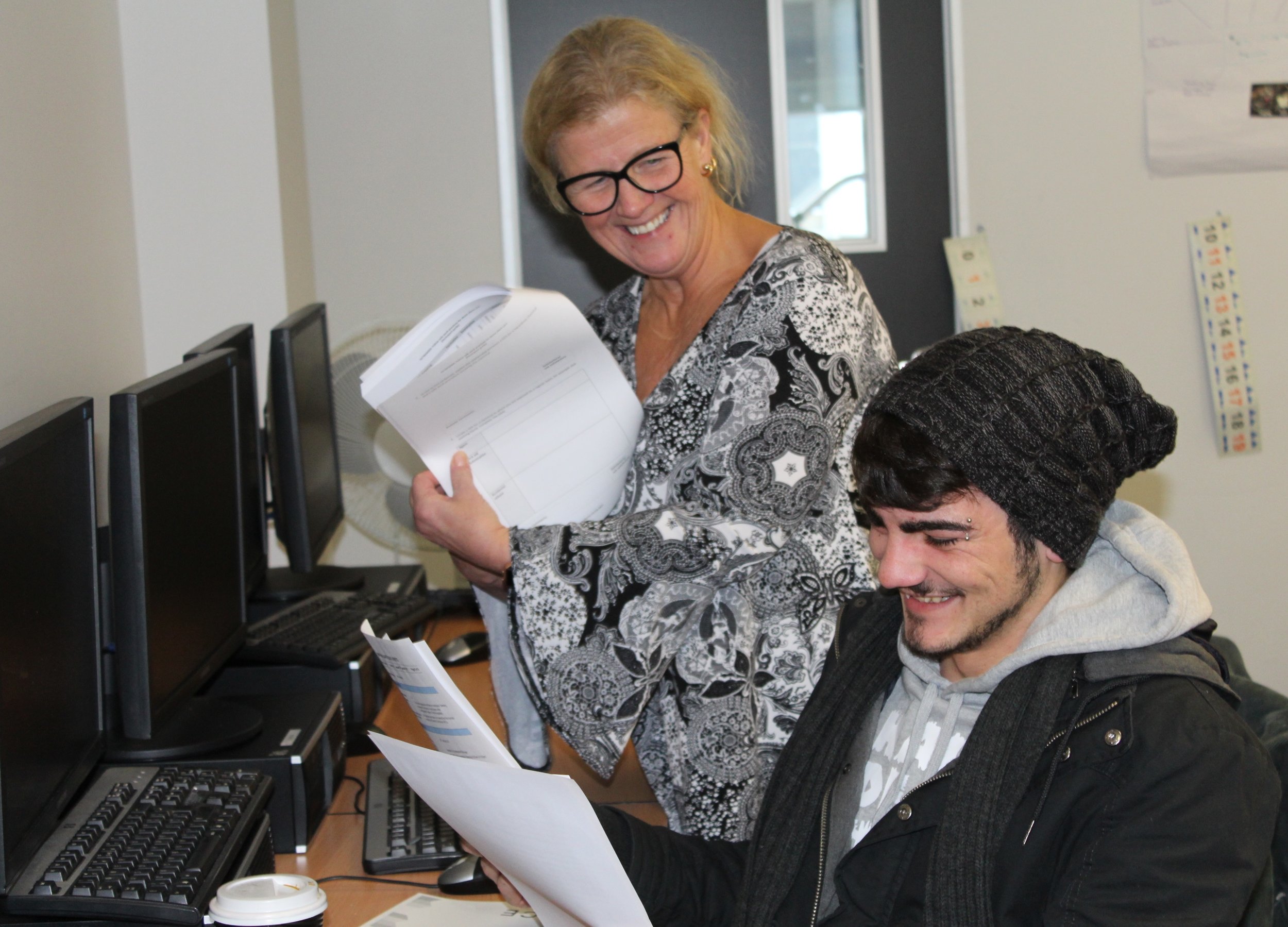 Susanne Westley, a trainer at BRACE, helps a student in the Certificate IV in Disability CHC43115 class at Frankston.