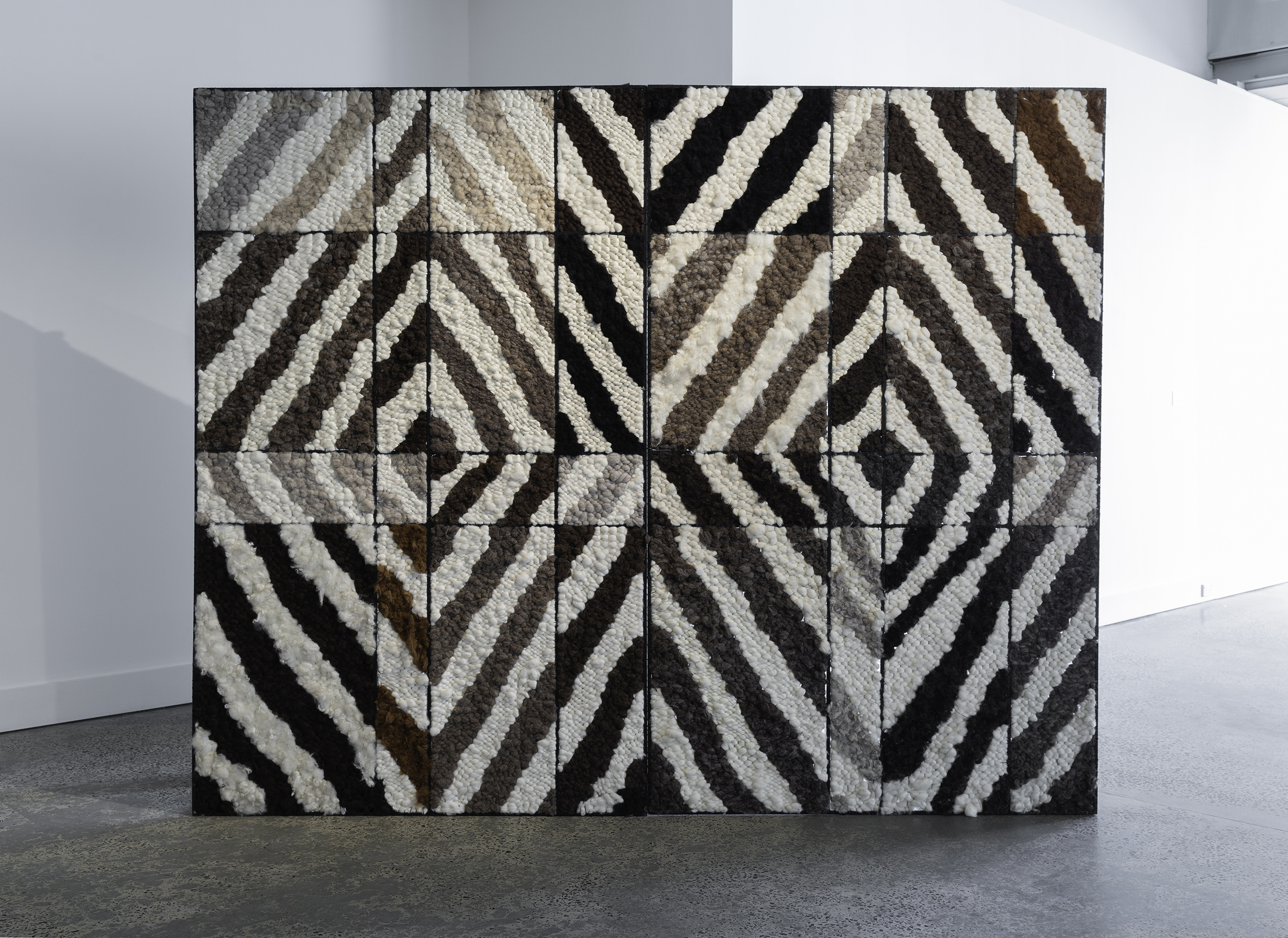 Sanné Mestrom’s&nbsp;Black Painting III&nbsp;2014, unspun undyed woollen tapestry, steel, 200 x 250 x 51cm. Photography by Christian Capurro.