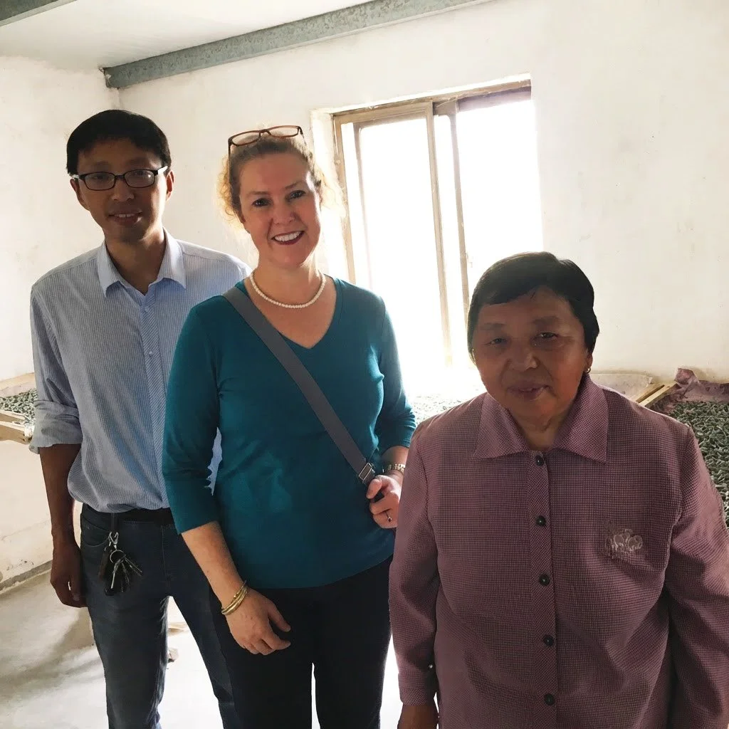 Laurian with silk farmers