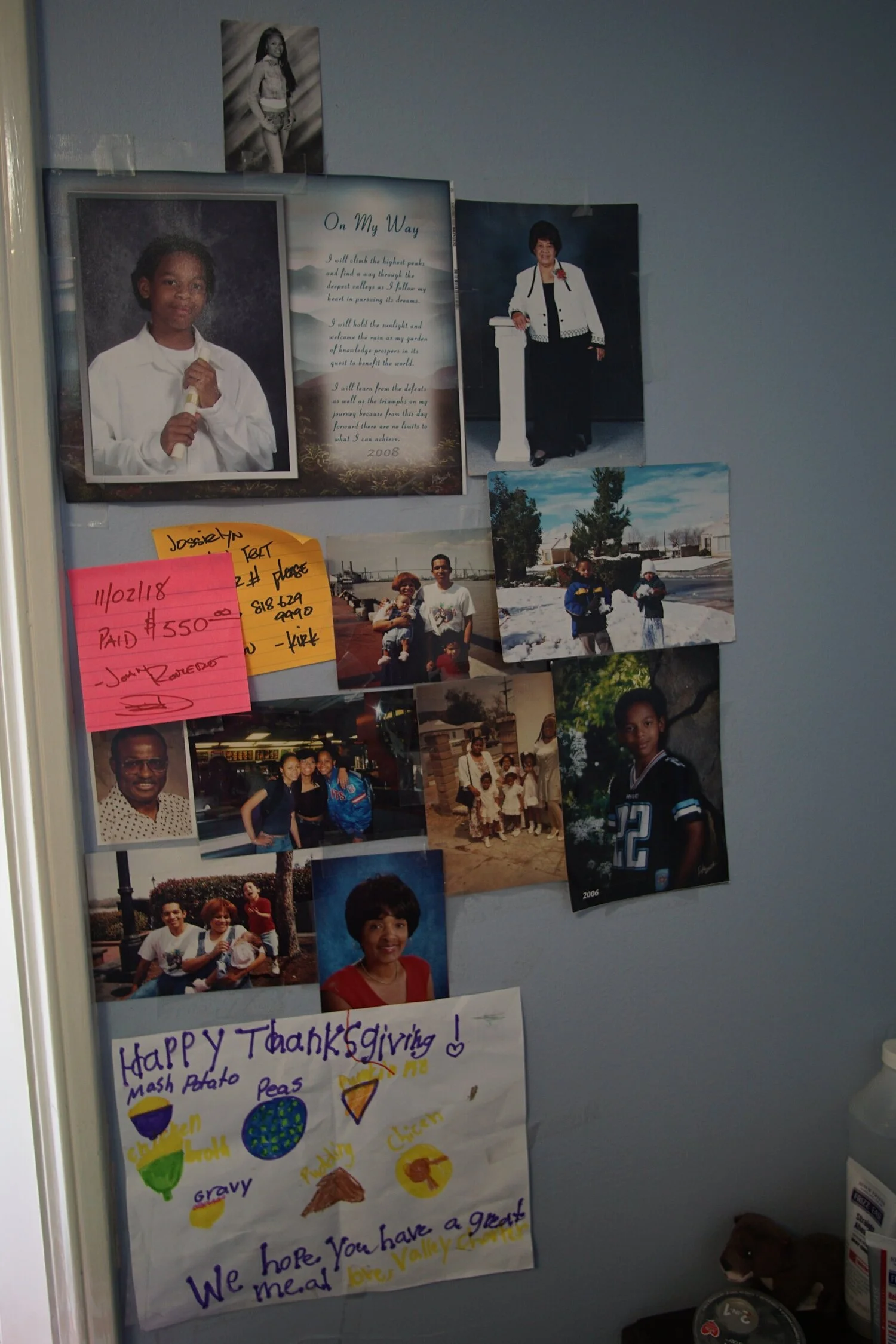 Images of Jessie’s family are posted on the wall of her room.
