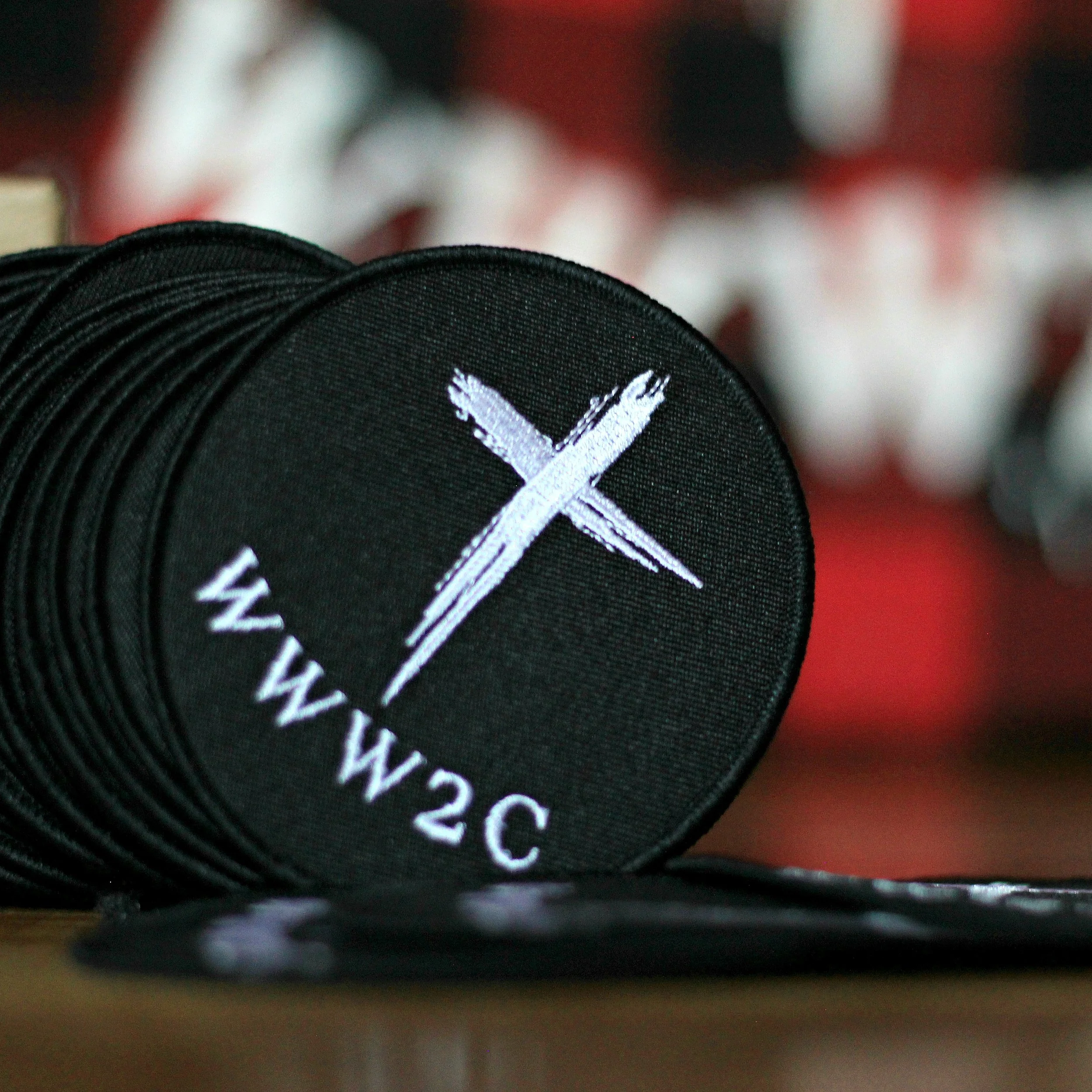 We Wear The Cross Patch (Black Oval)