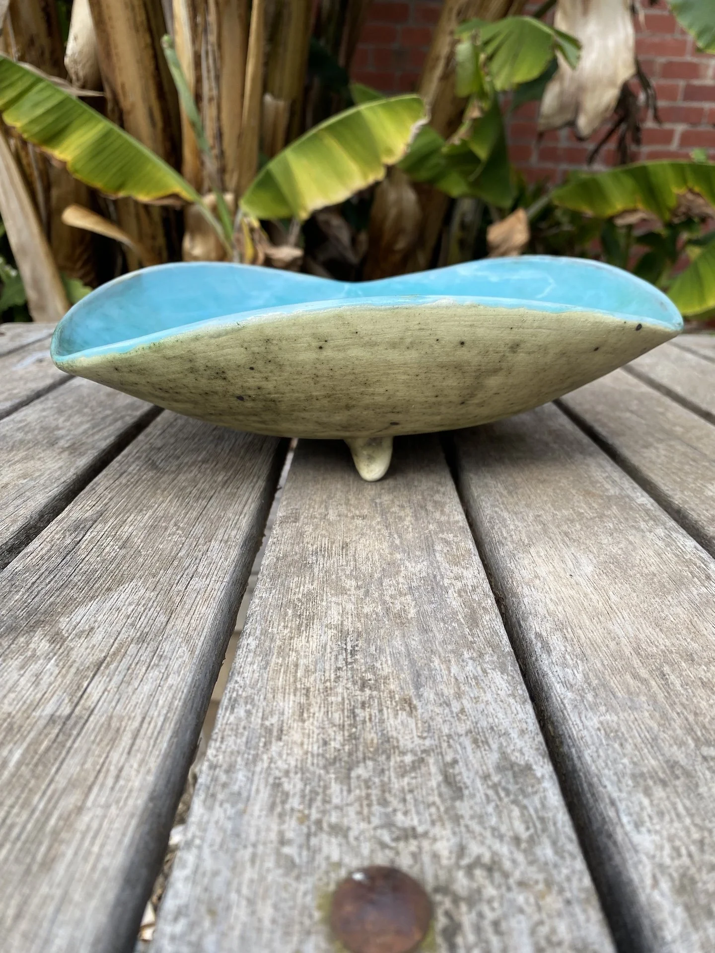 1980s Australian pottery tripod-footed dish with vivid turquoise glaze and hand-built form