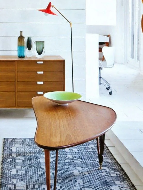 A floor lamp providing focal lighting to objects and punctuation to the end of the cabinet, but open to the room. The lamp itself is on full display in this position. Image courtesy iheartponyup.com