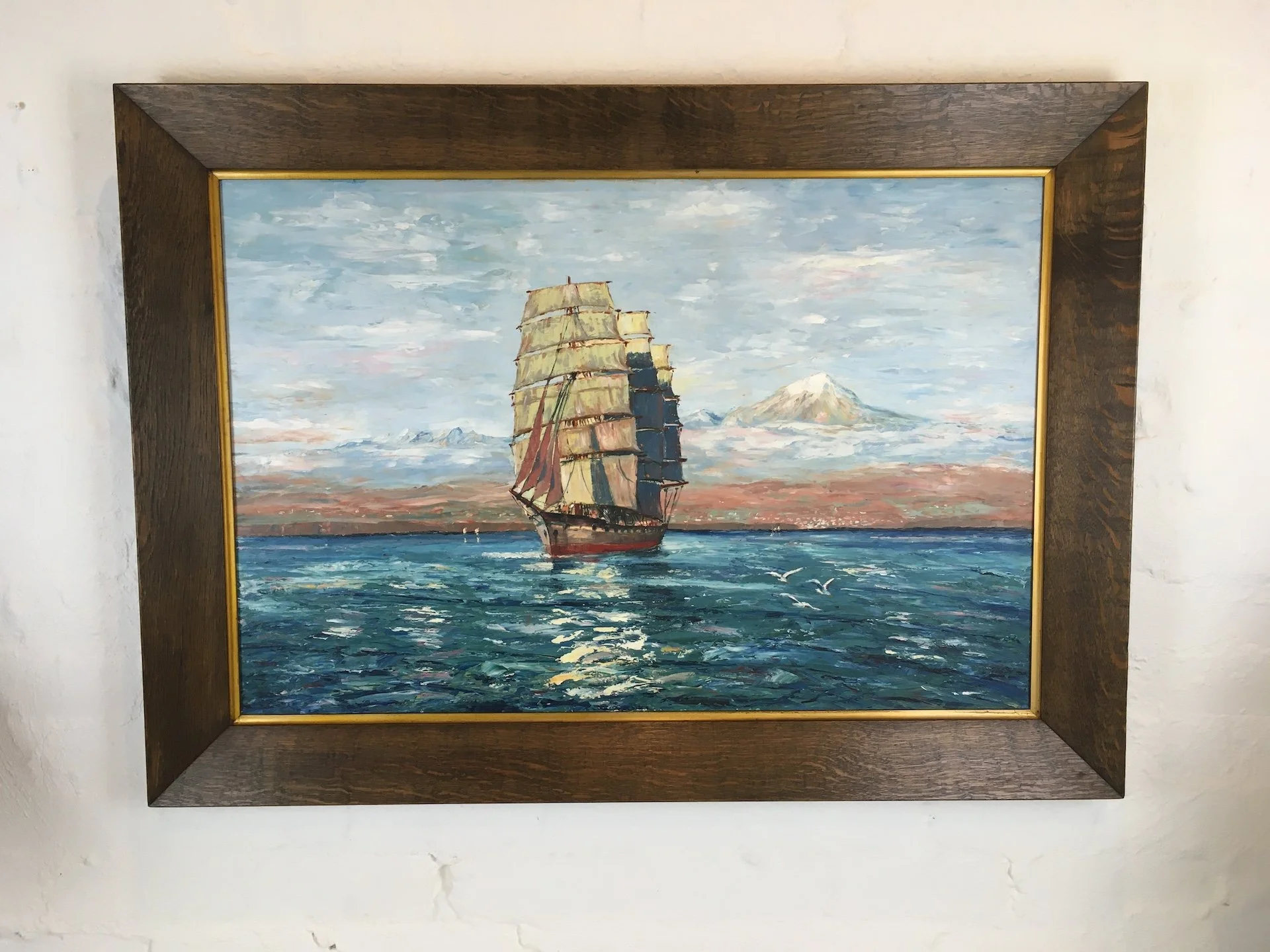 Large oil painting on board of a tall ship at sea, in the style of Hans Bohrdt, circa 1920