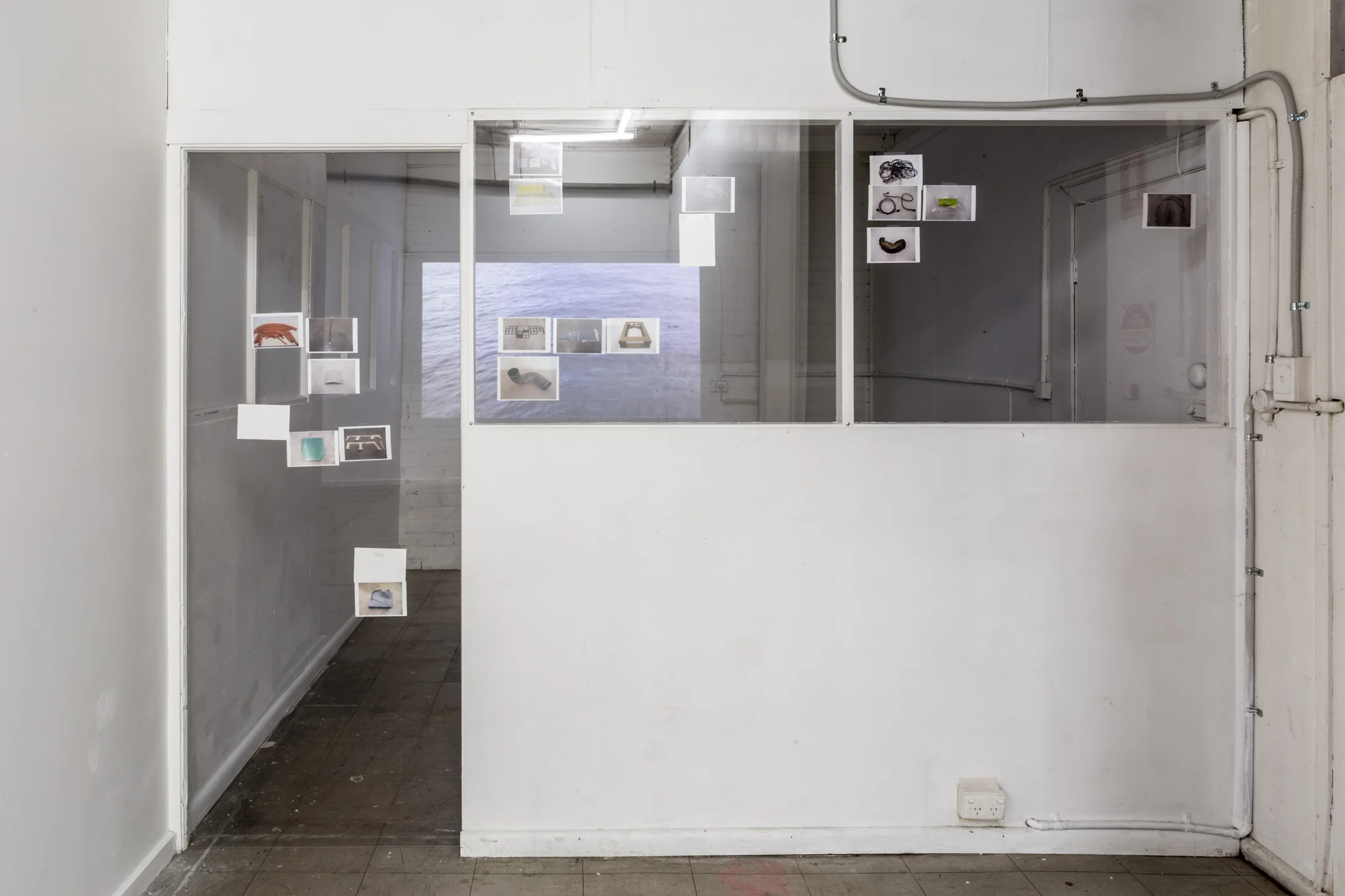 The Depth of the Problem, 2016, video (8m36s), perspex, photos at Punk Cafe. Photo by Christo Crocker.