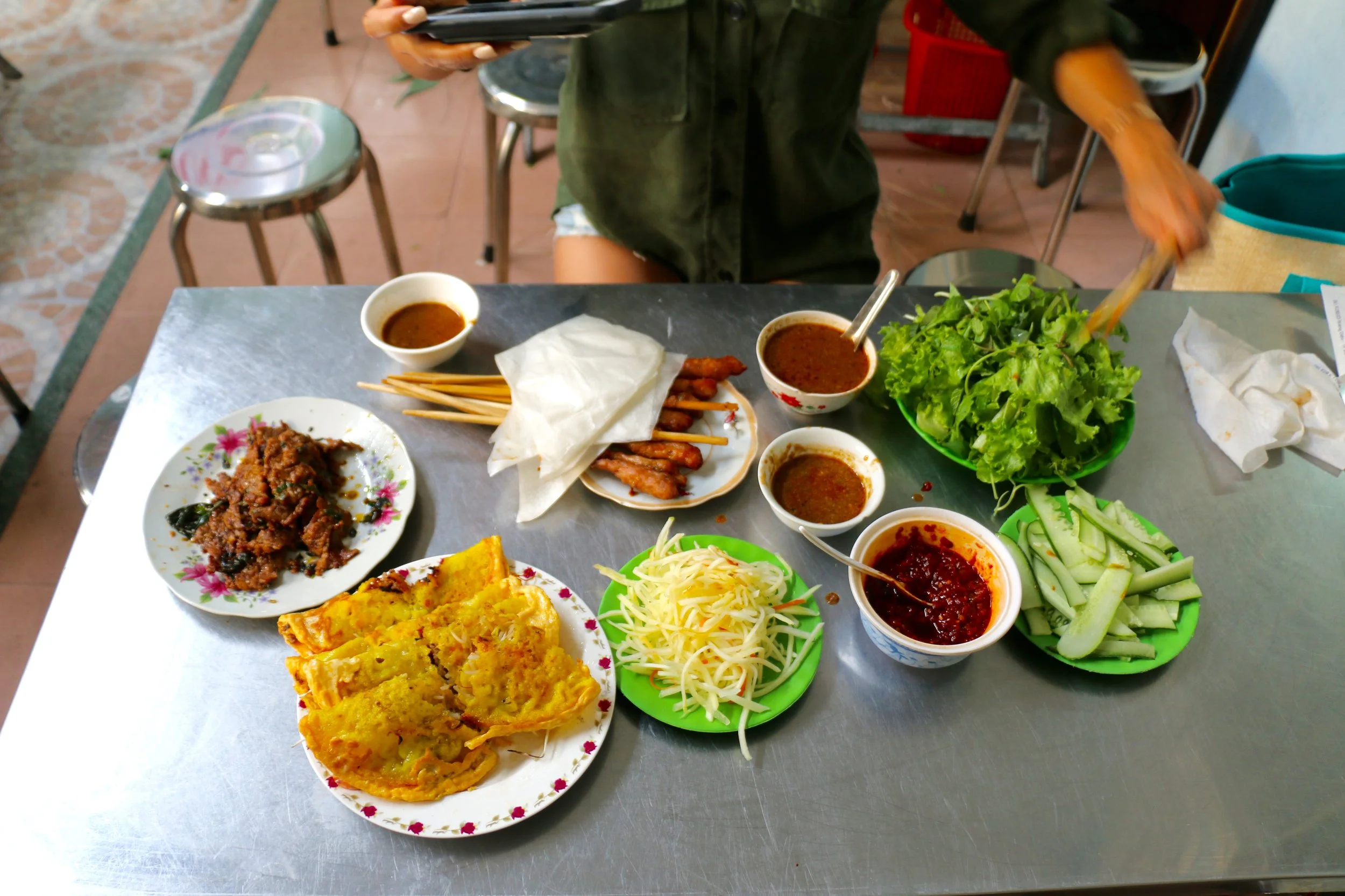 There really isn't a menu here. You walk in expecting Bahn Xeo (Savory Turmeric Crepes) paired with the "works." There's fresh rice paper skin, crispy crepes, fragrant grilled meats, fresh herbs, hot sauce, dipping sauces...your senses come alive here!