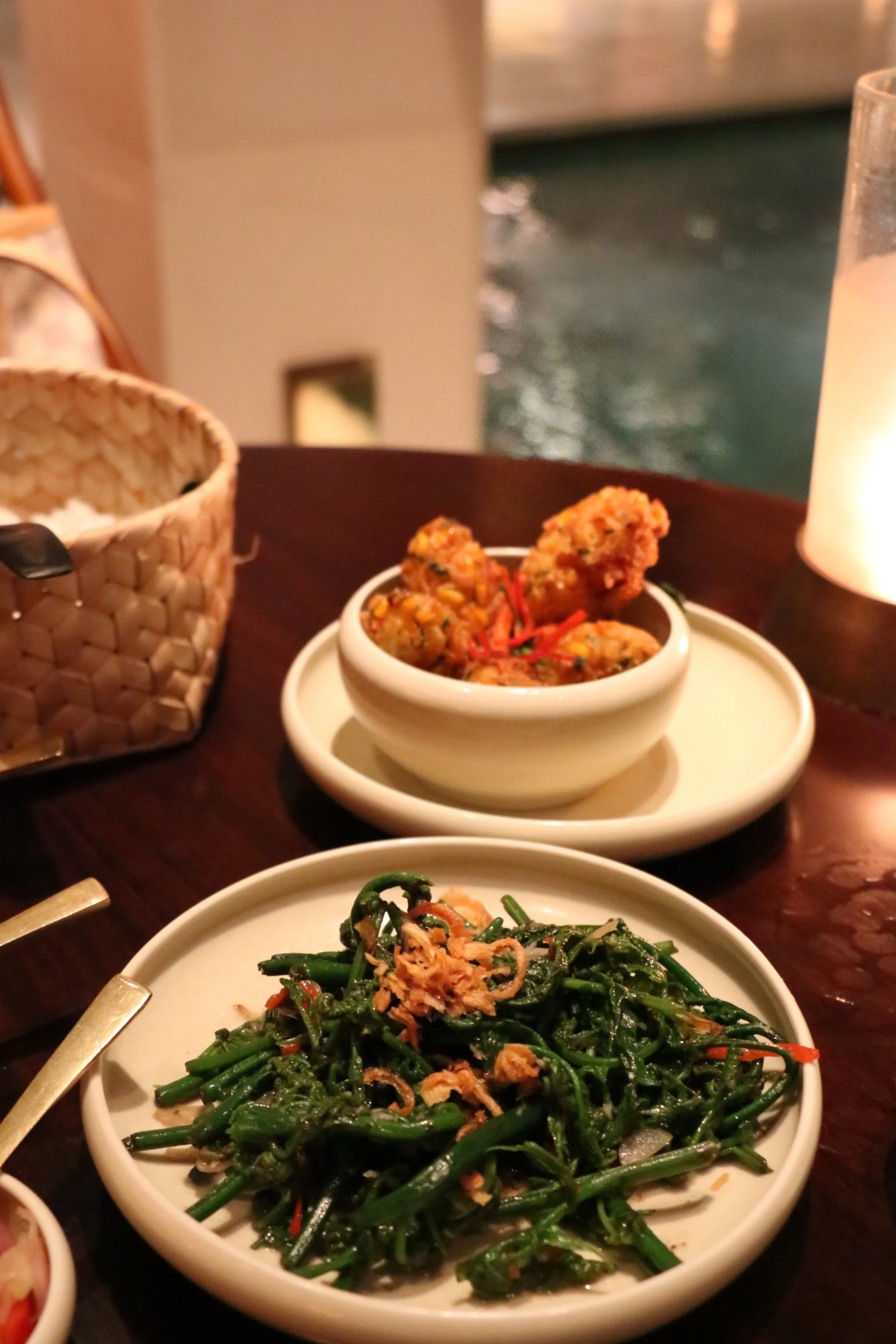 Stir Fried Morning Glory in all it's glory:) Lightly tossed with shallot, garlic, peanut oil, chilis and dried shrimp paste. And of course some corn fritters on the side because those light fluffy fried bites are soo addicting. Think of an Asian Version of a hushpuppy flecked with freshly shucked corn and chilis.