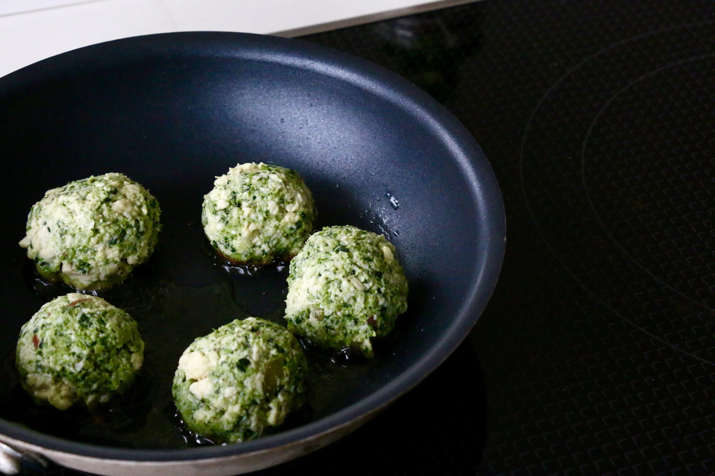 Form into small balls and start pan-frying one side