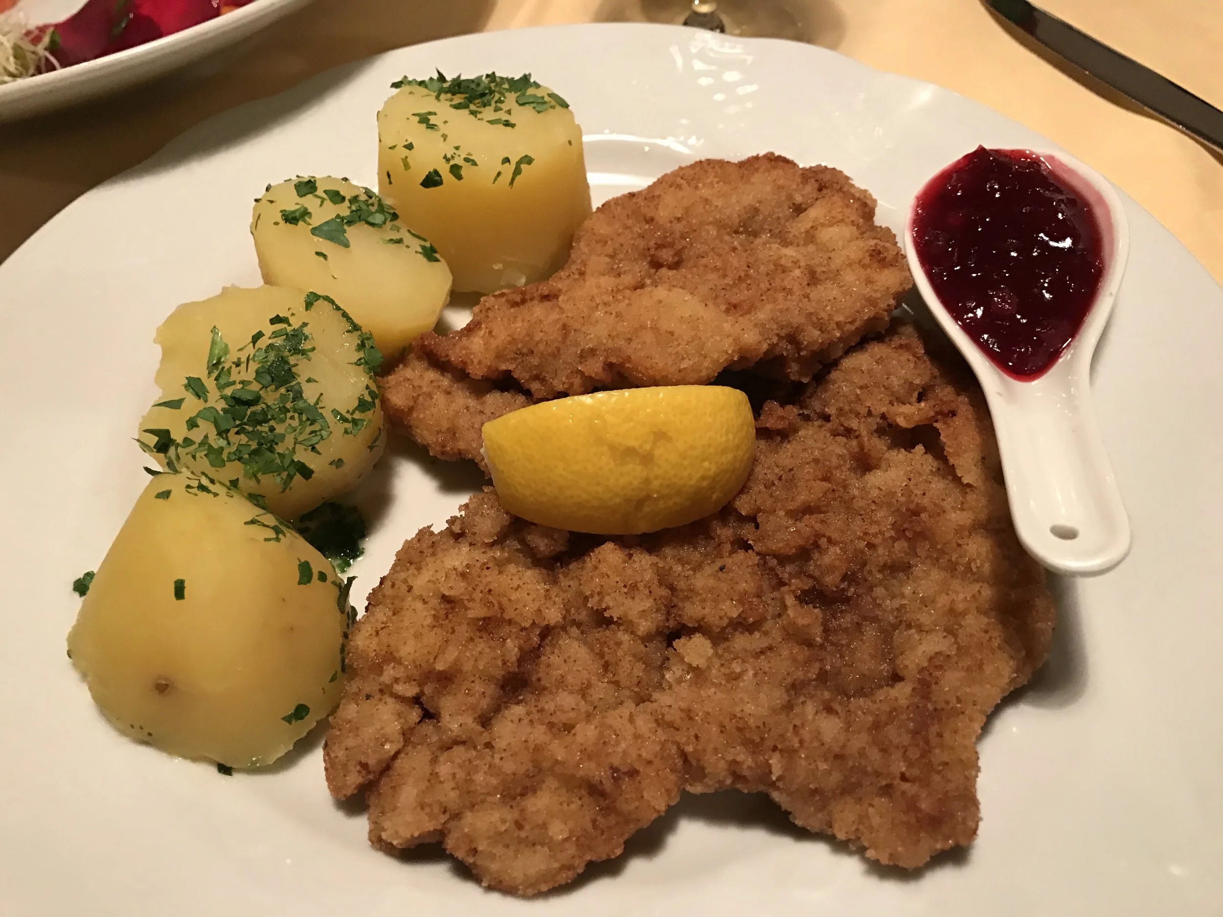 And finally the weiner schniztel, served with parsley potatos, lemon and cranberry sauce