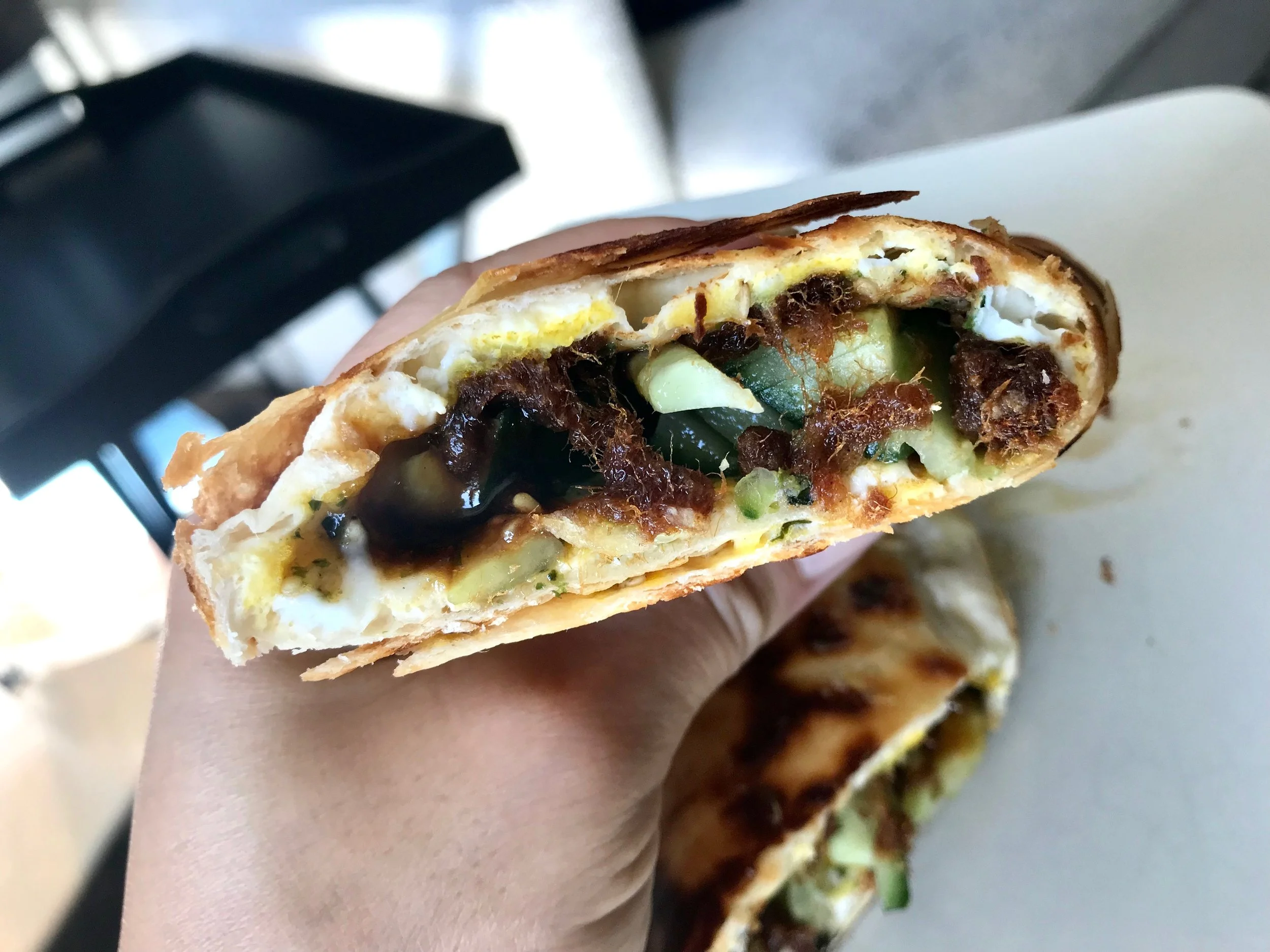 Crispy Exterior with nicely cooked thin layer of egg inside, flavorful pork and crunchy cucumbers