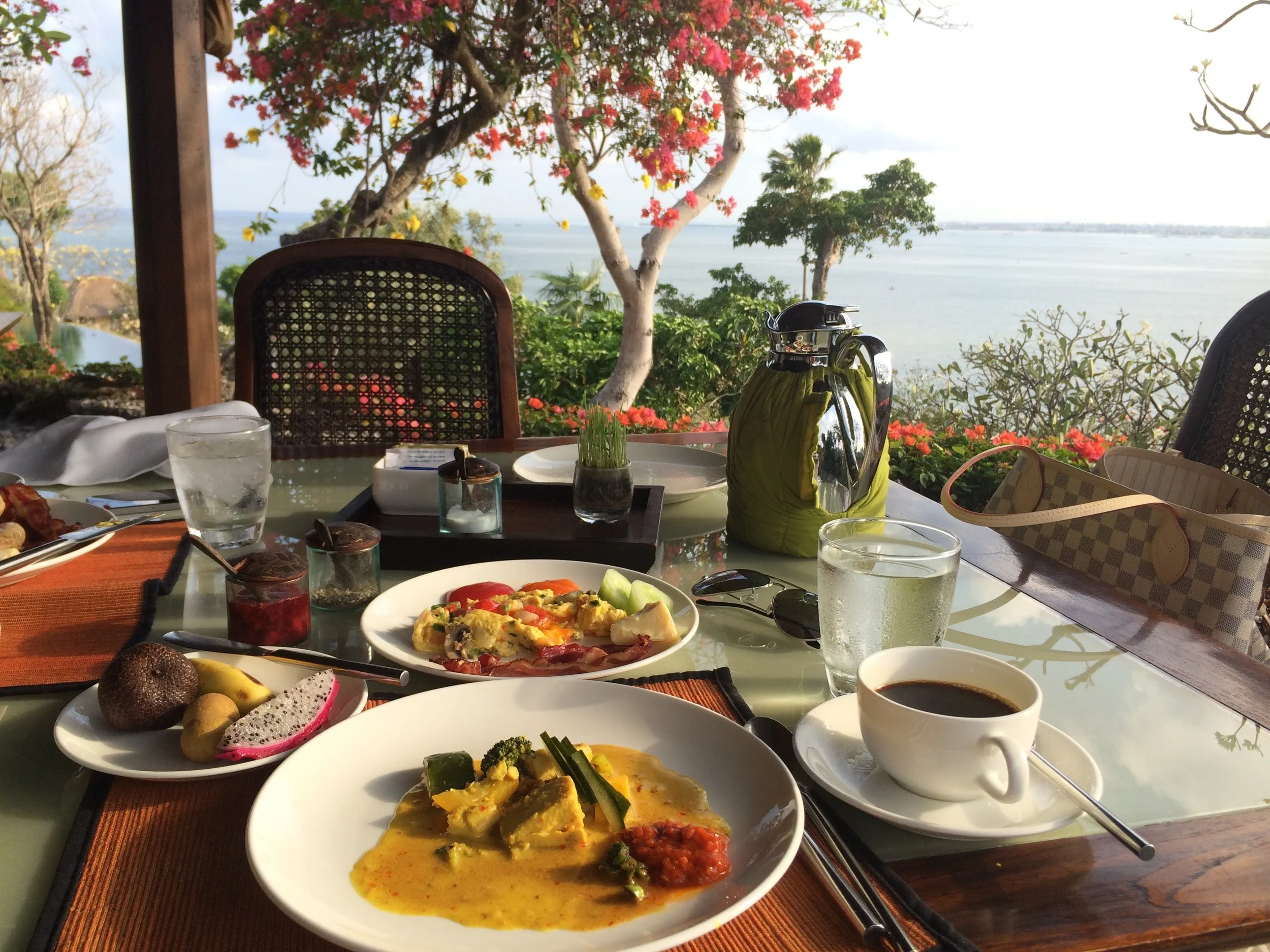 My spread: curry, sambal, vegetable scramble, some cut cucumbers and sliced tomatoes, and some local fruit (dragon fruit, banana, snakefruit and longan)