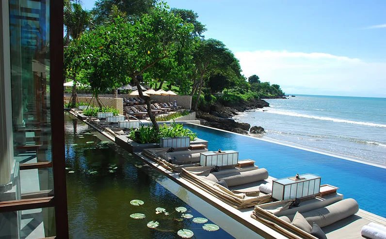 View of the left side of the sundara pool beach club overlooking the cabanas from the indoor dining area