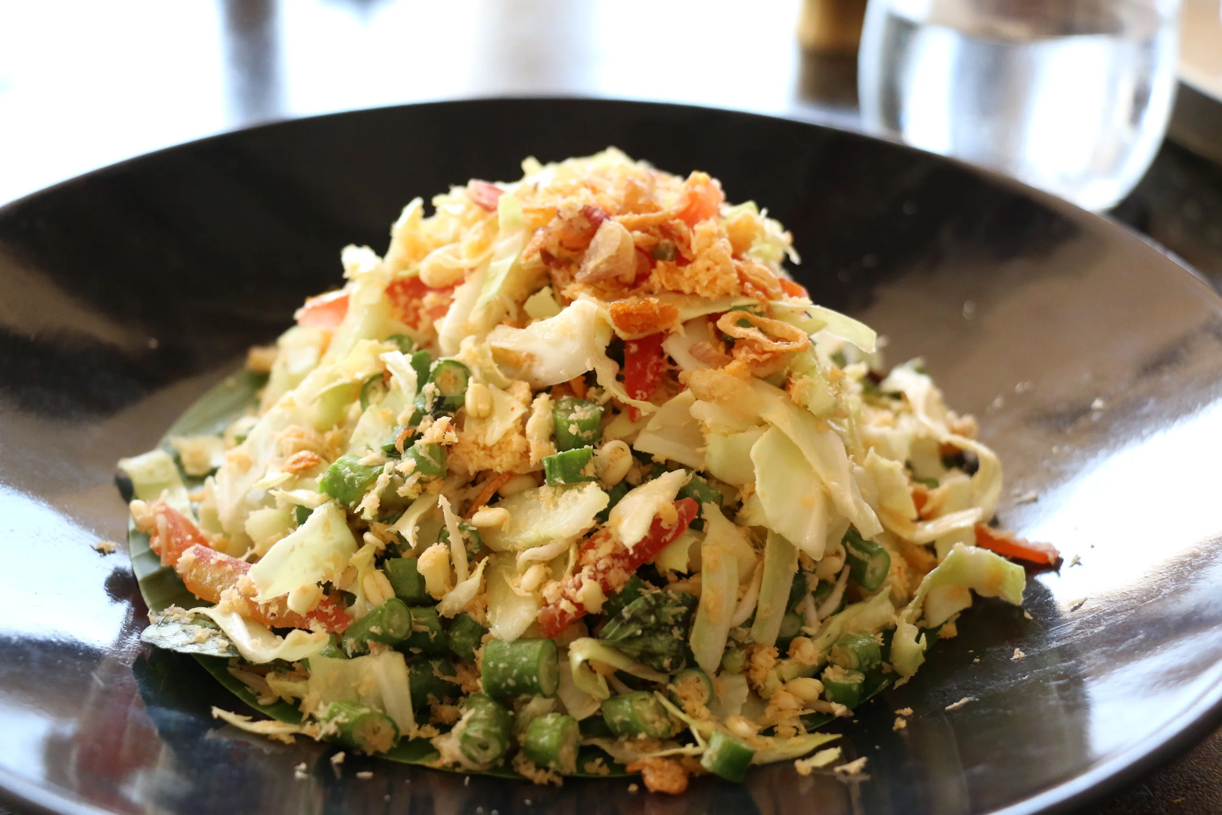 My appetizer: Balinese snake bean coconut salad tossed with tomato, shredded cabbage , bean sprouts, lemongrass, chili, garlic, peanuts, lime juice, shallots, sesame oil, and palm sugar. 
