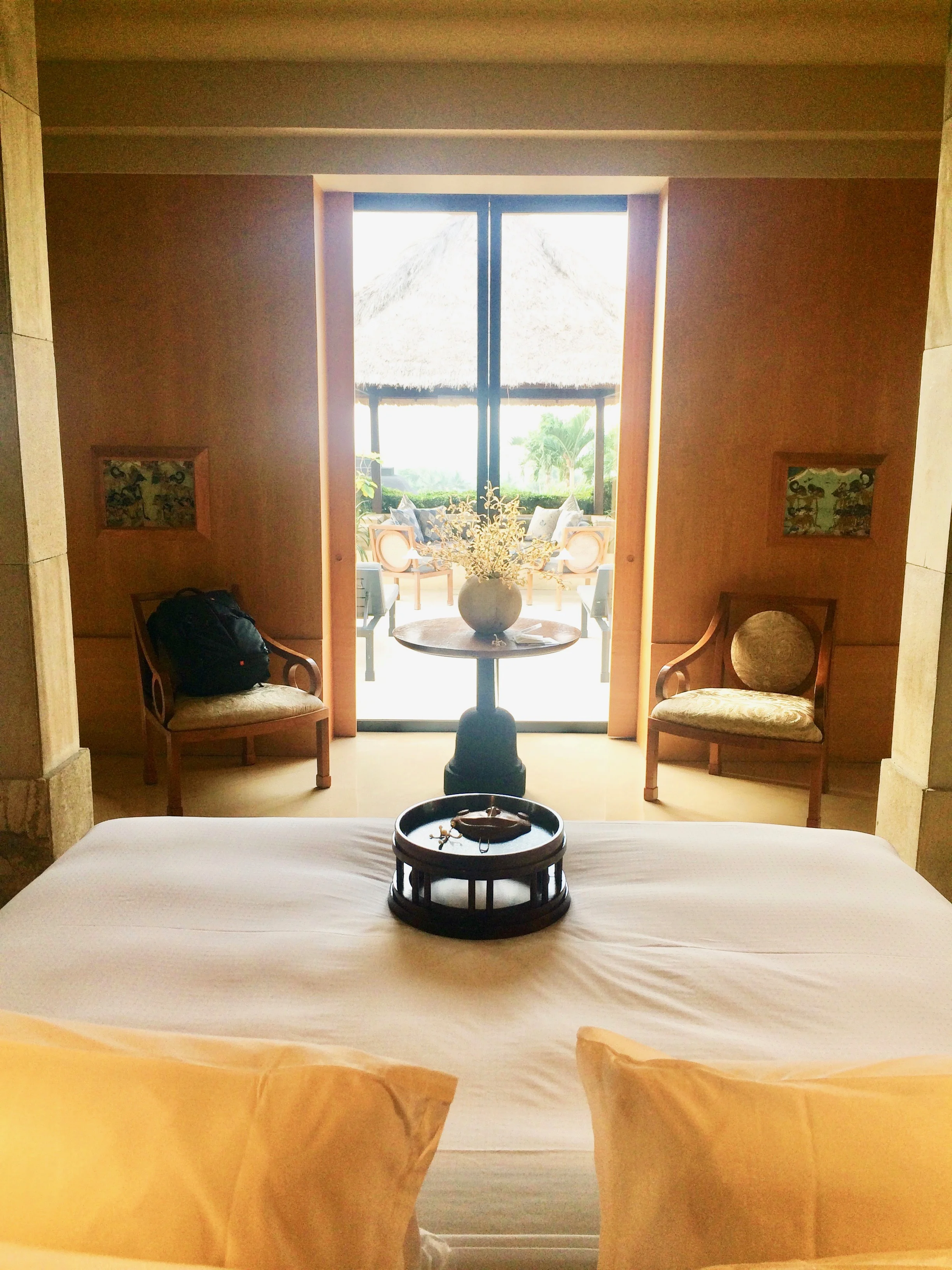 The center sliding door that leads into your personal terrace, daybed, and loungers. 
