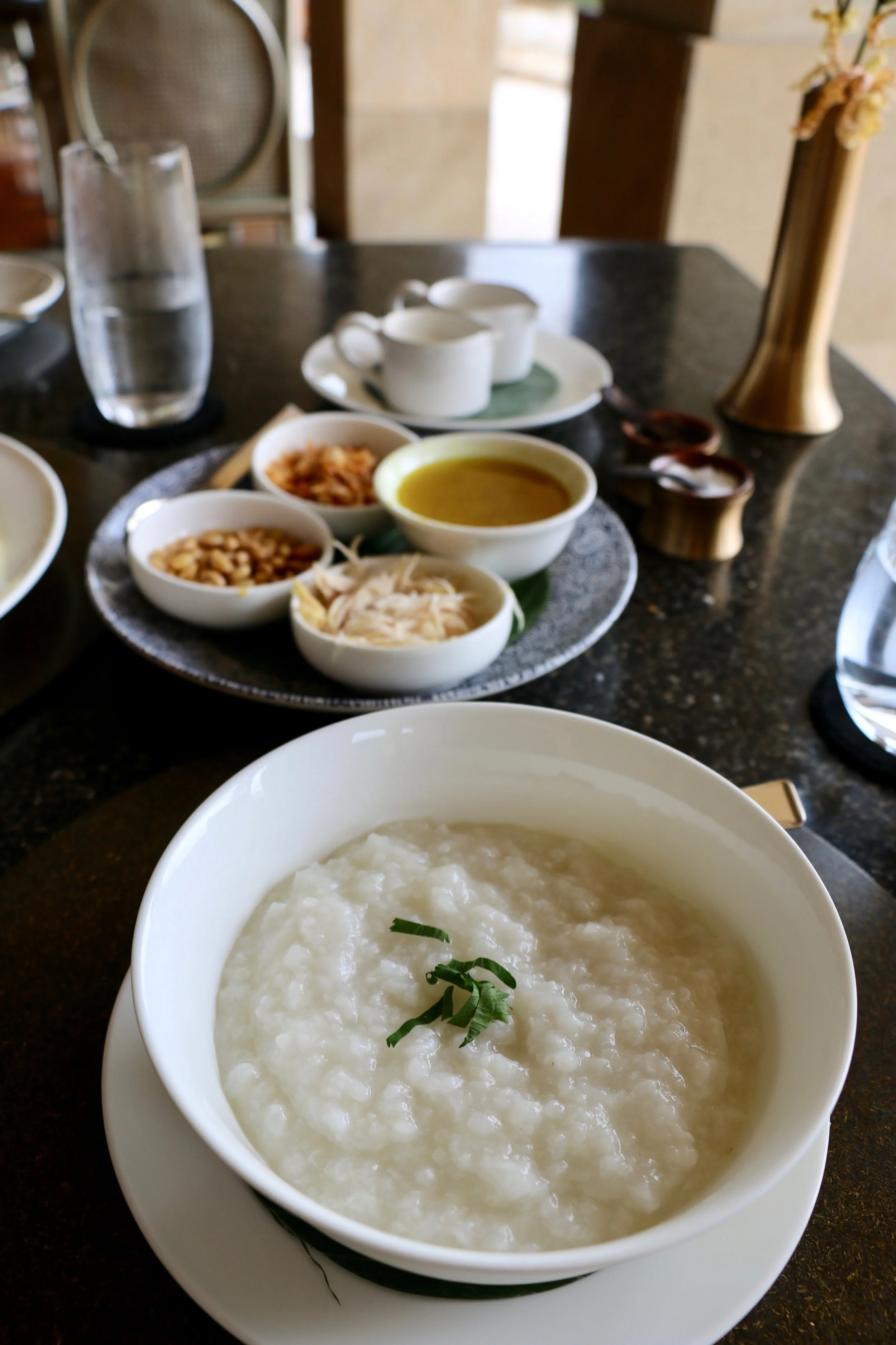 One of my favorite breakfast items at Amanjiwo from their a la carte menu: Bubur Ayam aka Indonesian Congee with Chicken. It comes with toppings like shredded chicken, fried shallots, crispy salted soybeans, a concentrated chicken broth with spices, and oils and shredded fried egg omelette.
