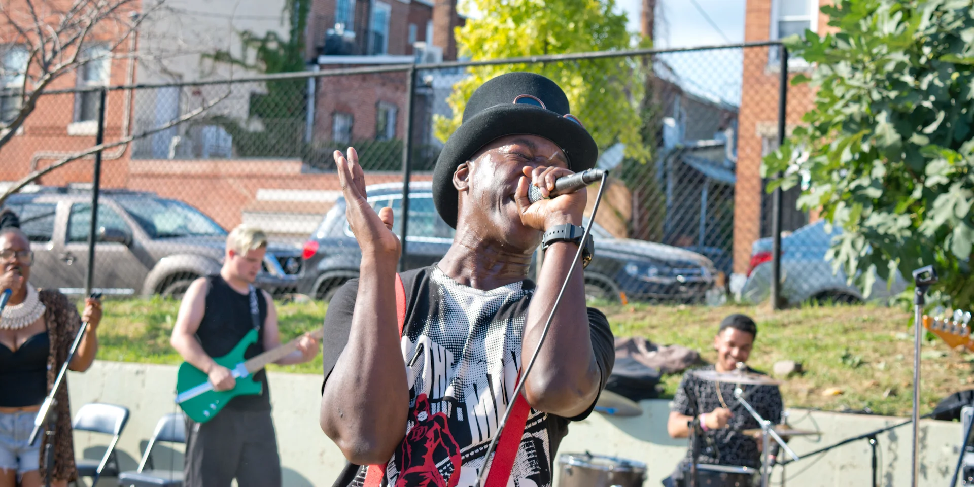 "I'm from Baltimore, and whenever I tell people that I'm from Baltimore they ask me, "Is it like The Wire?" It upsets me because the violence in our city, the crime in our city, what the news show in our city... they don't show the love. This song is for Baltimore. 'BMORE This is Baltimore, the most underrated north-south city pretty gritty, boarded up, with a whole lot of possibilities Wasn't born here, yet proud to call this place my home/ A New Test Spawn, immigrant, with no where else to go to This Bmore, be beautiful like our hearts desires/ We shine, and son rise, single moms tired, raising children into survivors, with charms that light up/ corruption and prejudice was the real reason for the riots This is Bird land, home runs call, two rings, Raven's claws/ Bea Gaddy, Dawson Family, Freddie Gray, tears fall Beyond the block, save a dope boy, before heaven calls/ Off the corner, half N half, chicken box, with hot sauce With a club bounce, got our own sound, with gold fronts, and a big smile/ Where Womb Works, right now, see ya around, down town If you call this bodymore, Murdaland, I guarantee You don't love this city, I'm bonafied, I say Baltimore with a T I represent Baltimore to inspire We be more than the wire Raising children into survivors With charms inside that light up This the City of hard luck Squeegee boys out here, just trying to make a buck Cease Fire just wants all the violence to stop While politics serve only the cream of the crop Rarely benefits us 12 O'clock boys wheelies pop Cops on the beat, like Baldamore HipHop Lost boys forgotten in the back of lock up Charm city is rough, like heroin addicts in love Naloxone nodding off At Lexington markets auction block As corny as this sounds Still, just say no to drugs Use all that you've got, fight the hate with your love Yes to more hugs Club music's a Paradox So, we dance with our heart This is where 300 men marched Like This is Sparta! We leave a mark, Foot prints in the dark we walk the walk, Dug eat dug Baldamore vs ya whores (all) crabs in a barrel is not a metaphor that's meant for us I represent Baltimore to inspire We be more than the wire Raising children into survivors With charms inside that light up'" ~Femi DriFish Neighborhood: Greenmount West