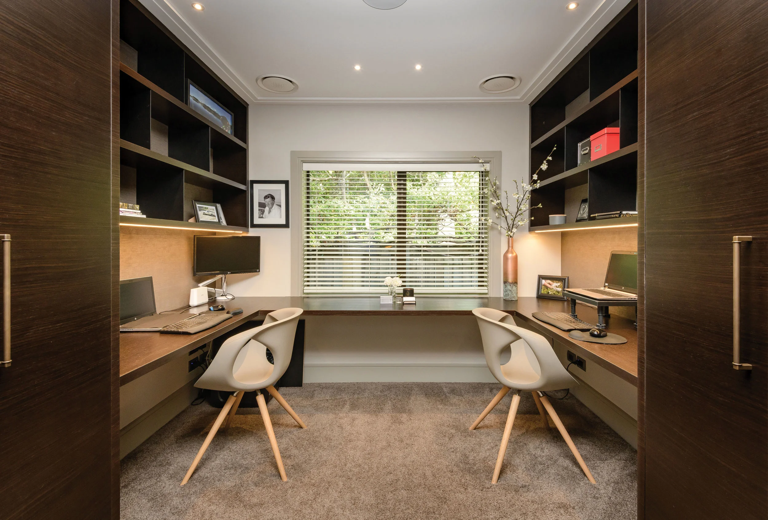 Office A fifth bedroom has been converted into a his and hers office with built-in desk and storage manufactured and installed by Advanced Joinery. The office chairs are the Up chair by Tonon from David Shaw.