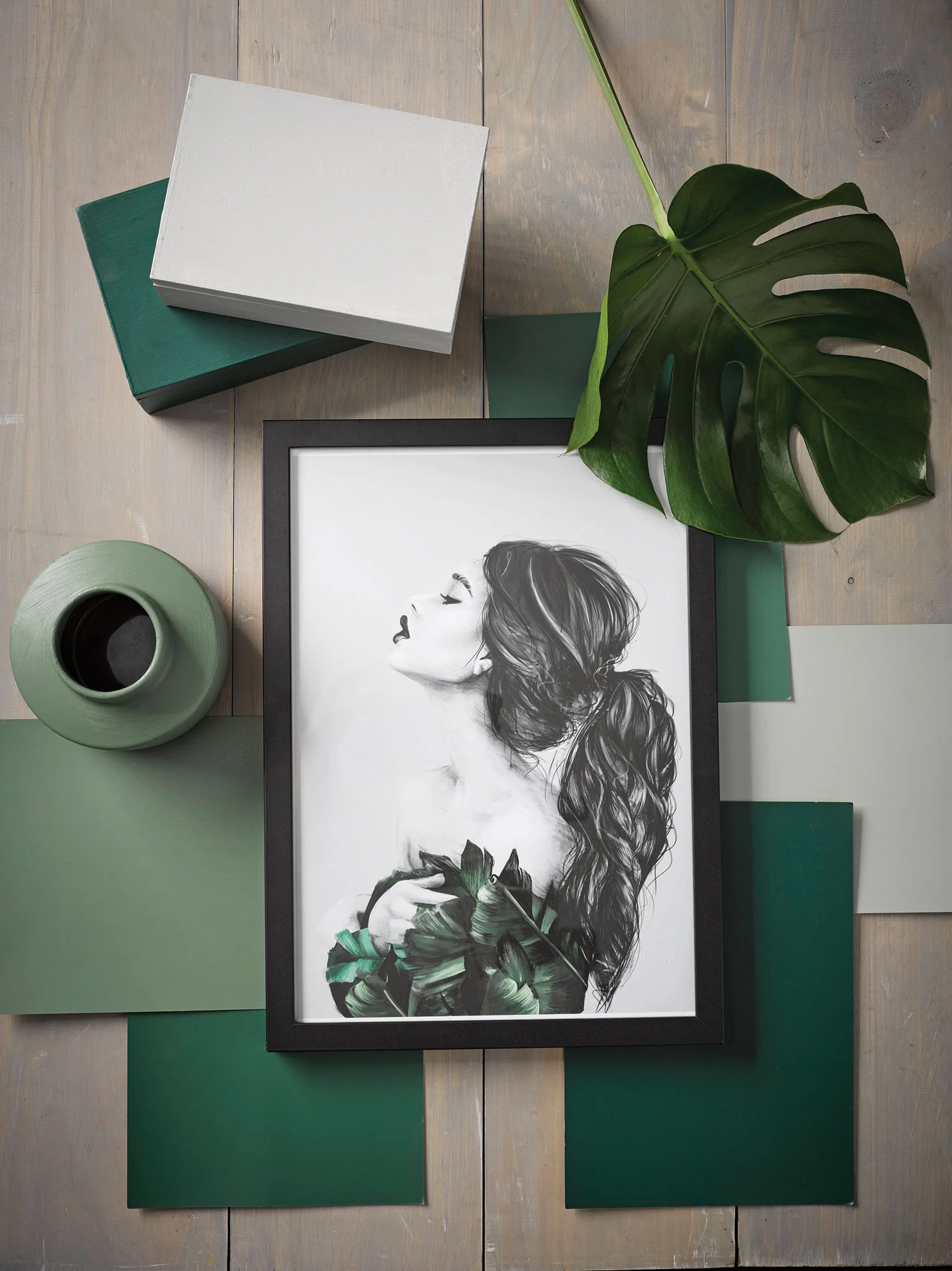 Moodboard: Background in Resene Colorwood Greywash, vase in Resene Peace, boxes in Resene Silver Chalice and Resene Permanent Green, A4 drawdown paint swatches in (from right, clockwise) Resene Permanent Green, Resene Peace, Resene Family Tree, Resene Aura and Resene Rivergum