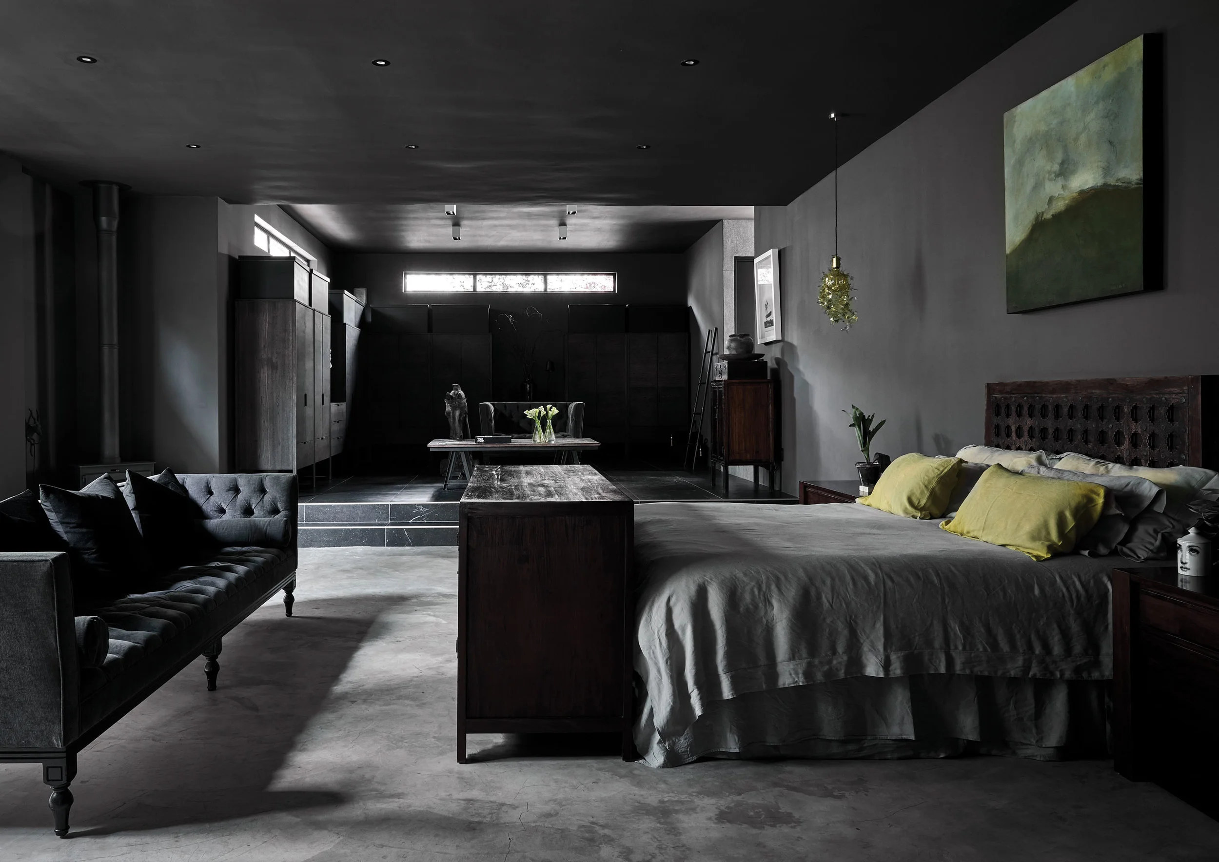 BEDROOM The master bedroom and dressing room emphasises horizontal space in contrast to the vertical space of the living room. The sofa is from Julian Decor and the garland light is by Tord Boontje.