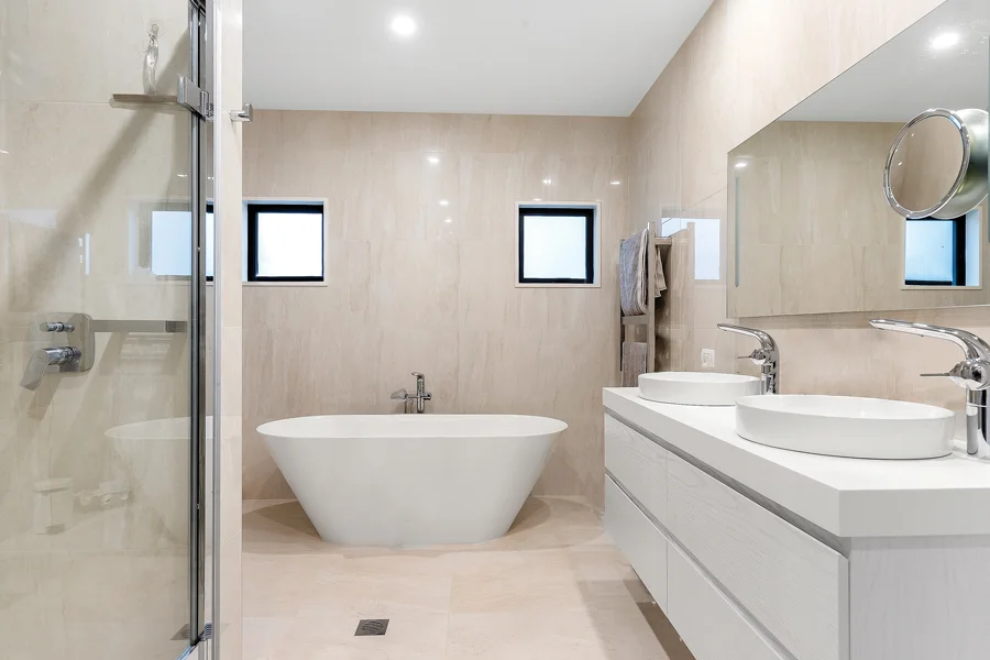 Master Suite: The master bedroom is adjoined by a luxurious ensuite bathroom complete with twin basins and a freestanding bath.