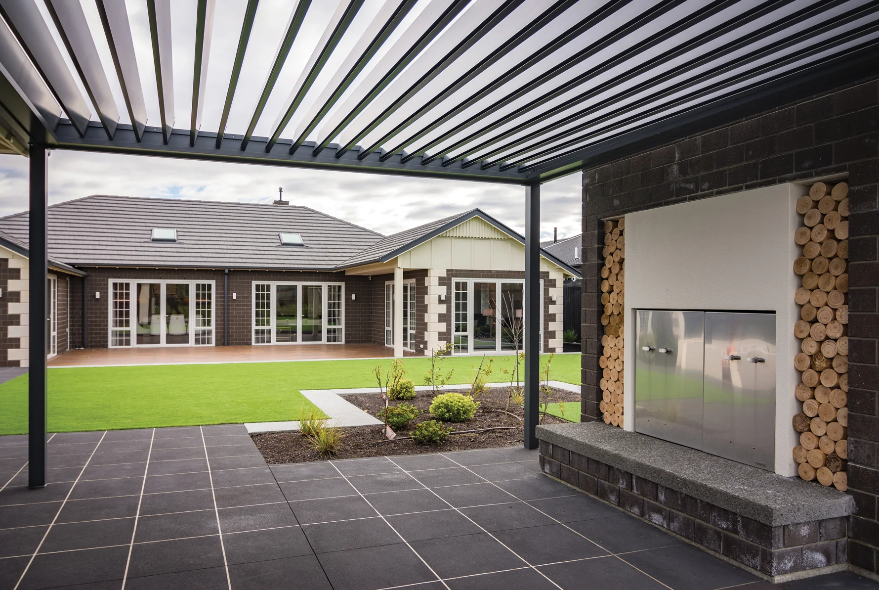 OUTDOOR SPACE: Full of delightful features and creative uses of materials, this area has been beautifully landscaped by Styx Property Care, with input from Cornerstone Drainage, Affordable Concrete and Division Architectural Engineering.