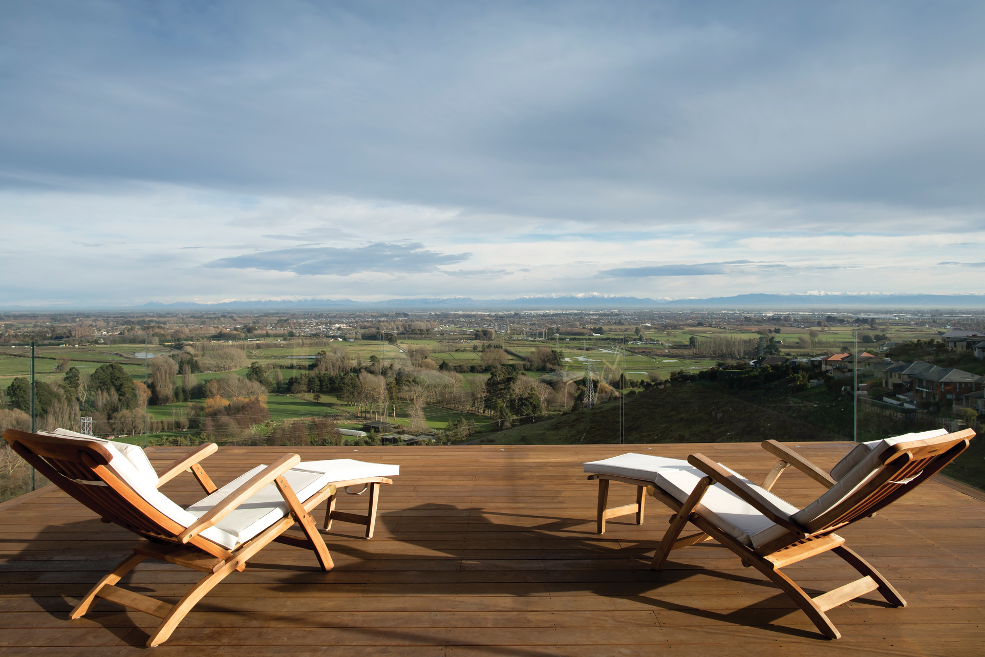 EXTERIOR: Glass balustrades from Euroglass provide shelter without obstructing the superb views from the deck.