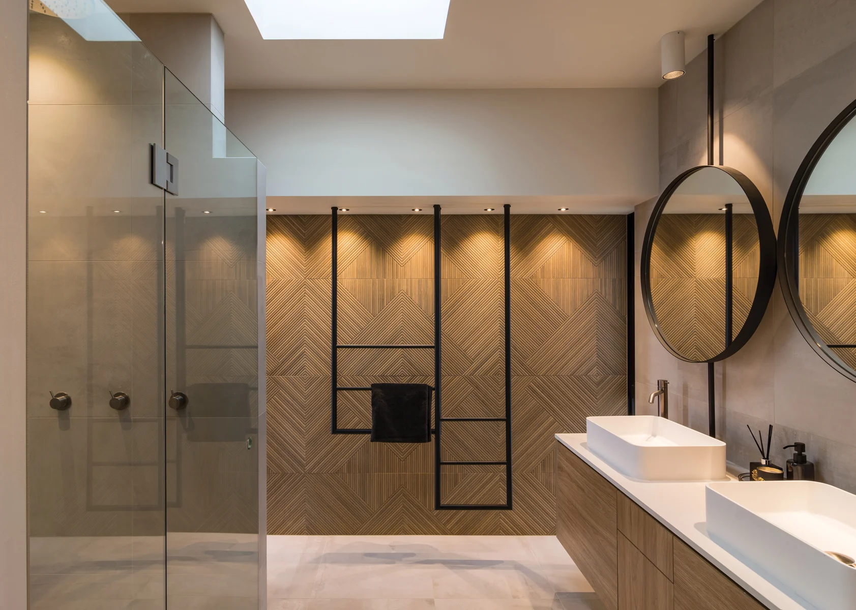 BATHROOM: The ensuite bathroom features exquisite timber-look tiles to provide a connection with the timber used in the bedroom and wardrobe furniture.