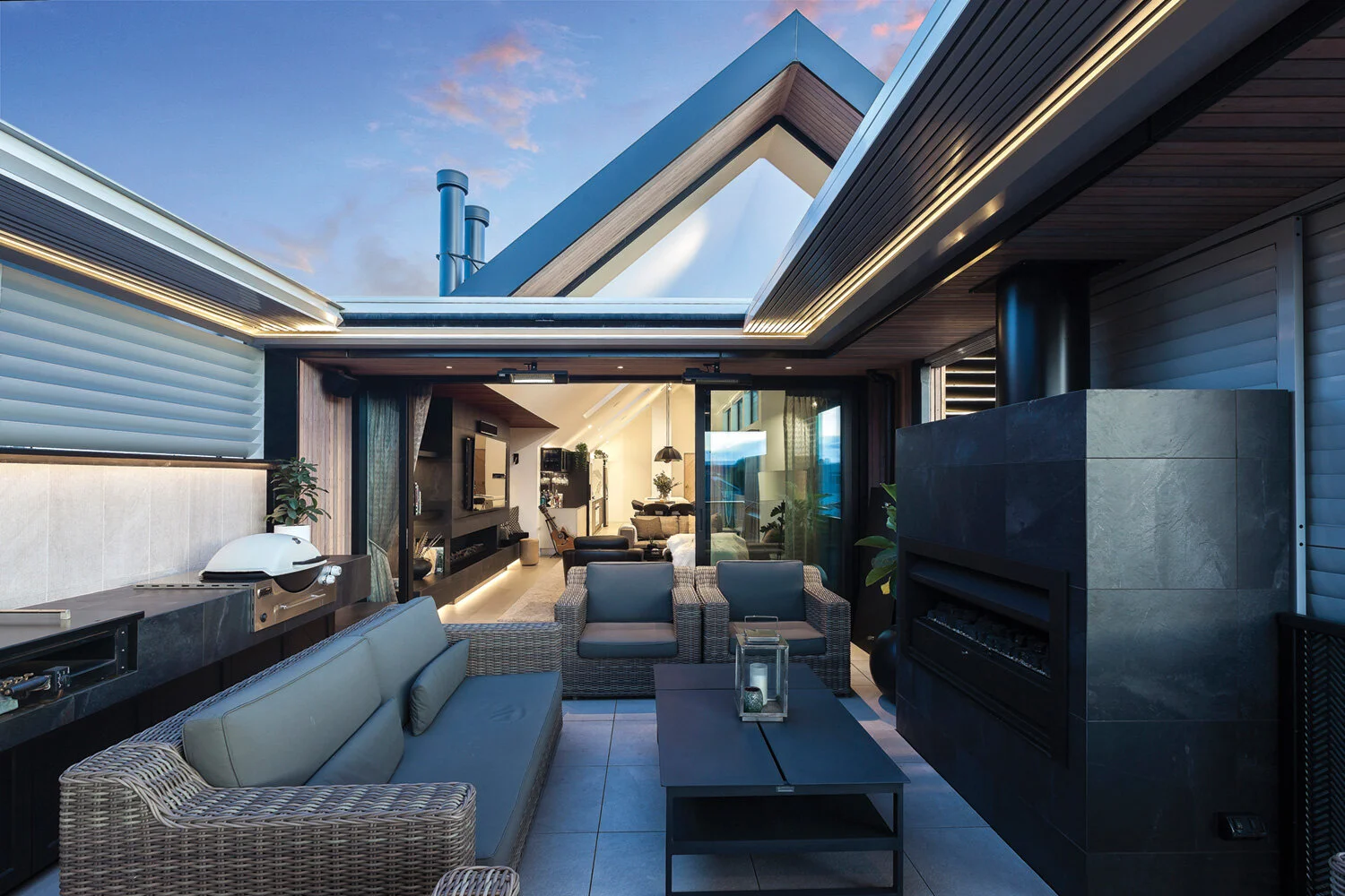OUTDOOR LIVING The Johnson &amp; Couzins’ SkyLouvres feature in many areas of the home, including the opening roof, sliding Atlantis shutters and fixed privacy SkyLouvre.
