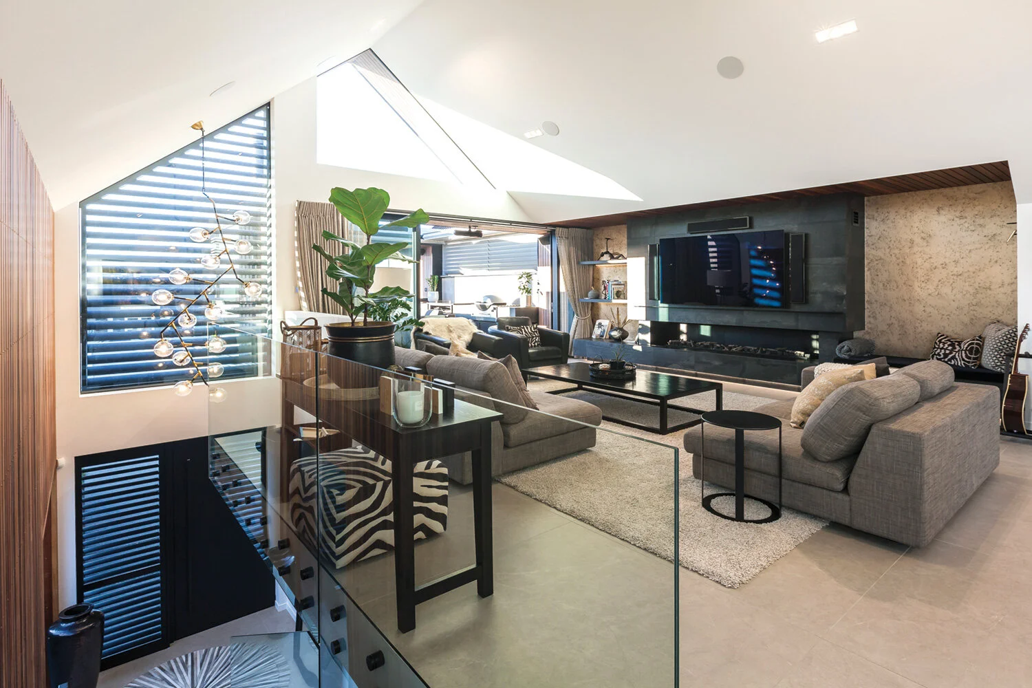 TILES Tiled floors throughout the home are completed in Arkistone Griege from Naturally Tiles.