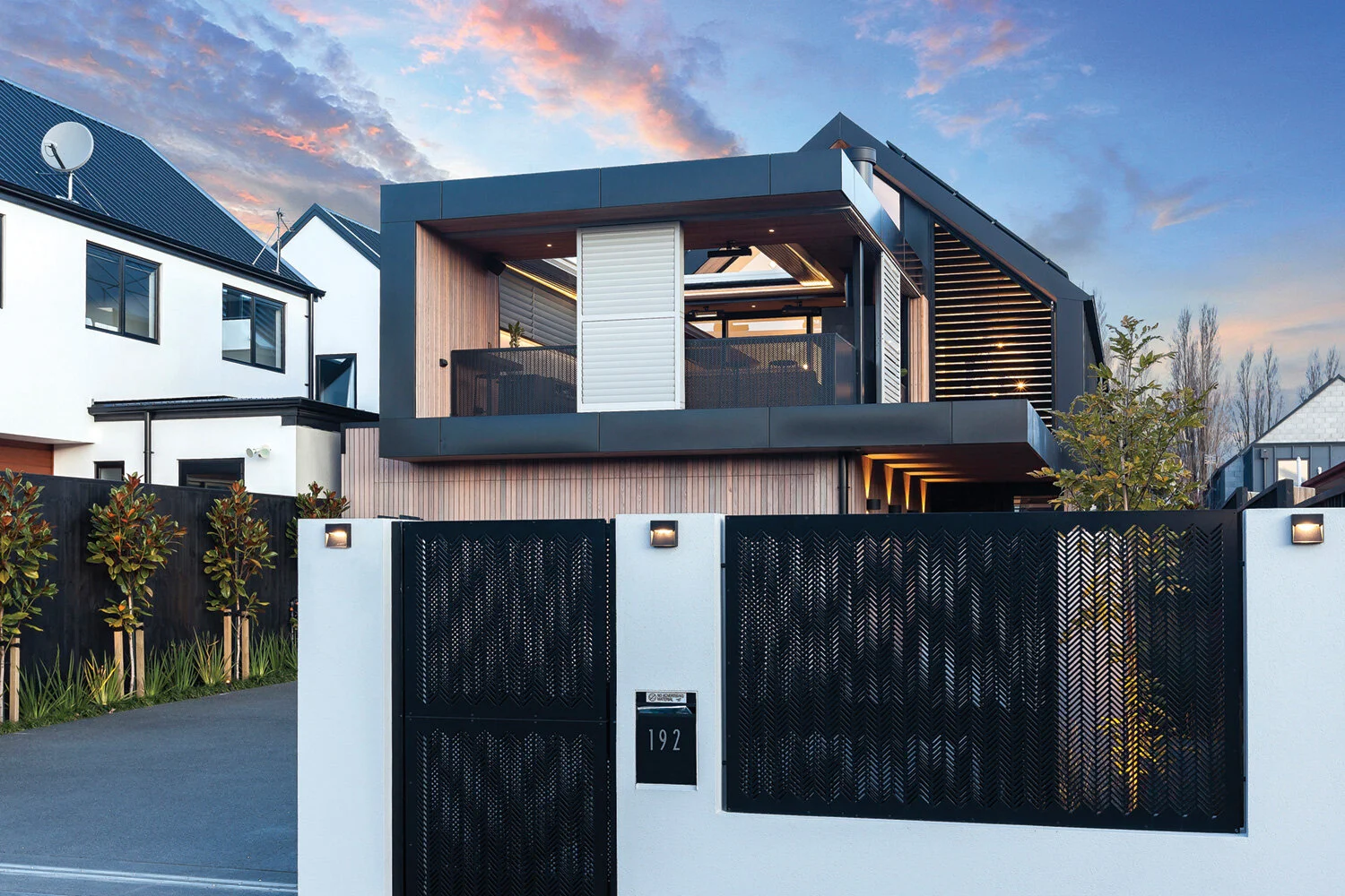 GATES The fence panels and multi-leaf sliding gate were fabricated from perforated aluminium panels on steel frames and powder coated by Christchurch Wrought Iron and Metalwork.