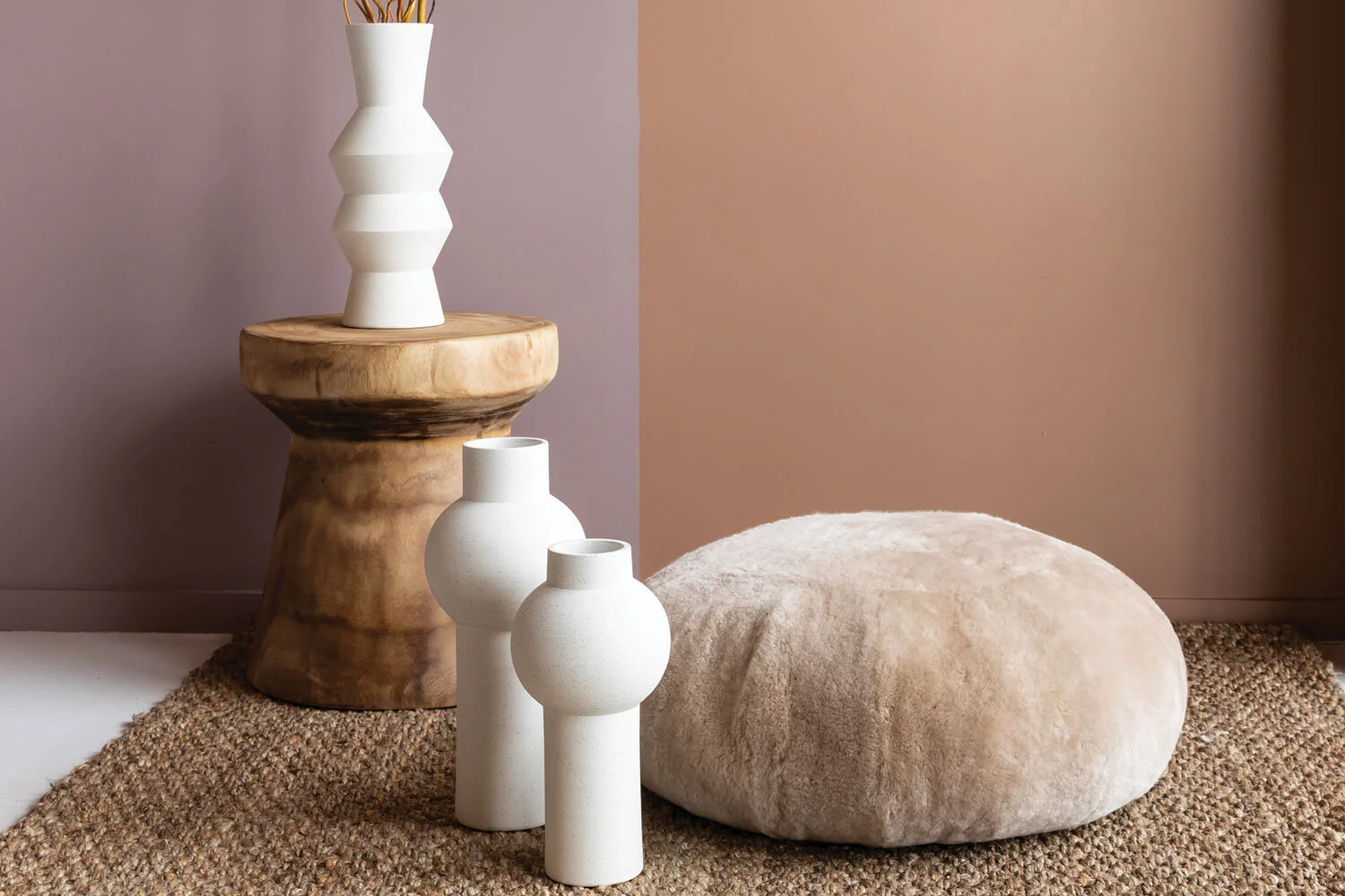 ORGANIC FORMS The sculptural vases from Ned Collections are the perfect muse to the neutral palette. They add texture and organic forms, and seeing them in a trio moves the eye and connects the space. Adding dried willow sticks provides height and connects the colour of the sofa to the space.