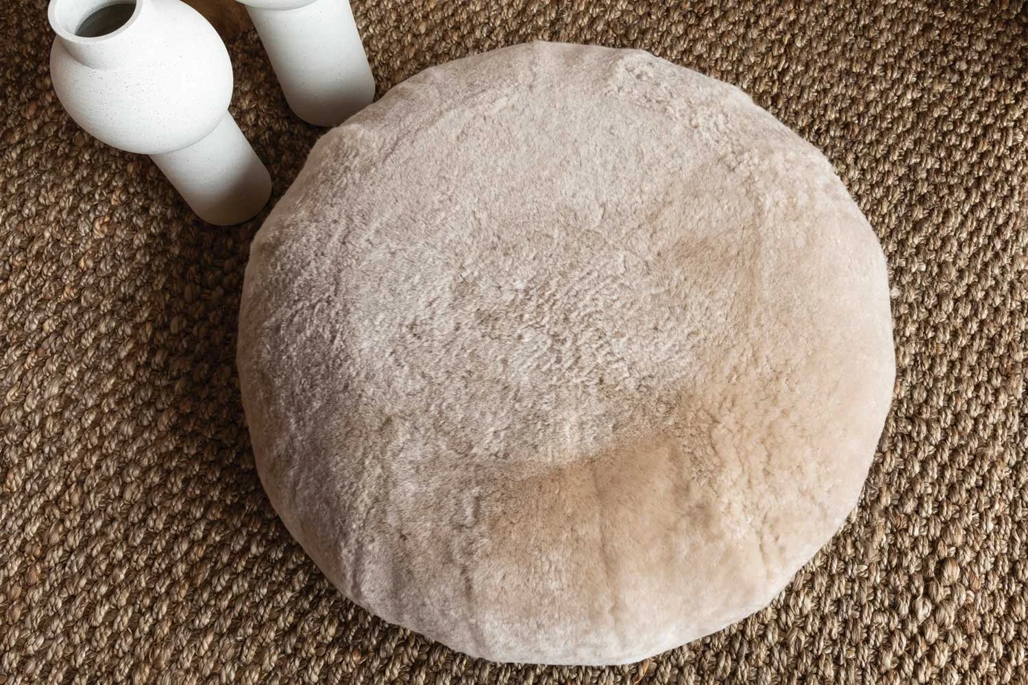 GROUNDED WARMTH Grounding a space with a textured and neutral rug ties a room together and makes a cohesive space. In these colder months, a rug is an easy way to add a layer of character and toastiness.