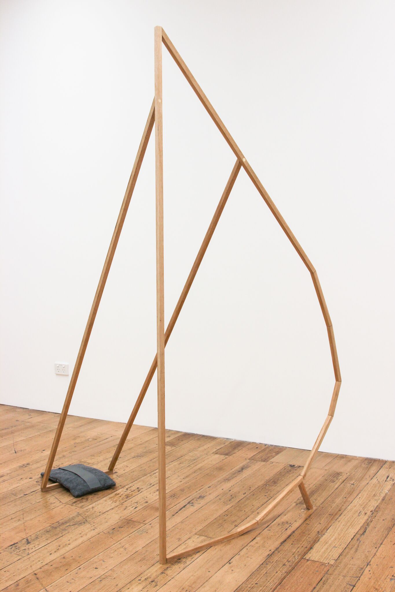 Curved Support Frame (Just Holding Up), from the A veritable (un) mooring series 2017 Tasmanian oak, glue, dowel, screws, wood, putty, wax, vinyl, felt, sand, plastic sheeting, cotton thread, photographs. Image courtesy the artist.