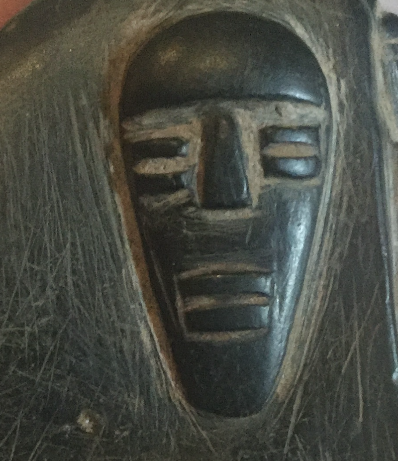 Hundreds of lines surround the raised figures which are caused by a blade which was used to prise the wax models form the stone.