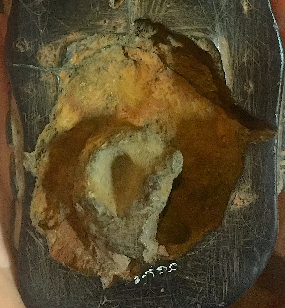 An unidentified metallic ring is encased within the artefact, currently defying scientific explanation.