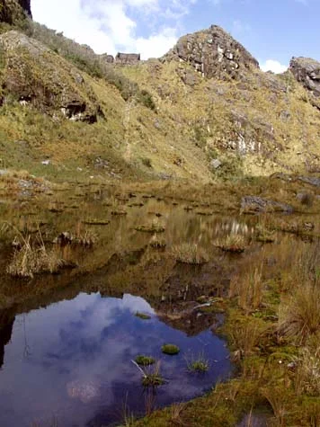 Inca Wasi located on the summit in the distance, with an enhanced ceke line leading to a basin of water, directly west of the building.